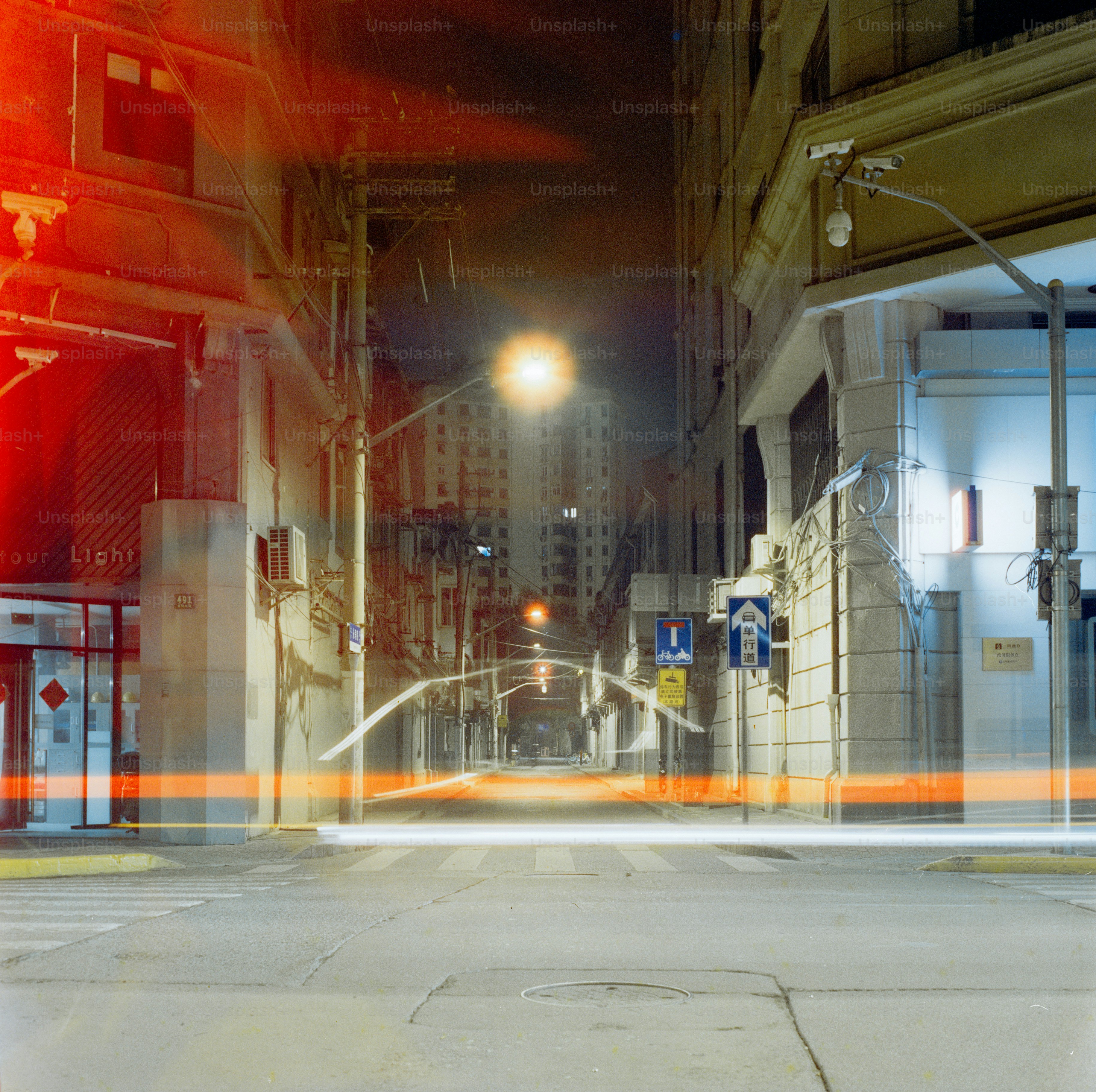Nighttime city street with lights.