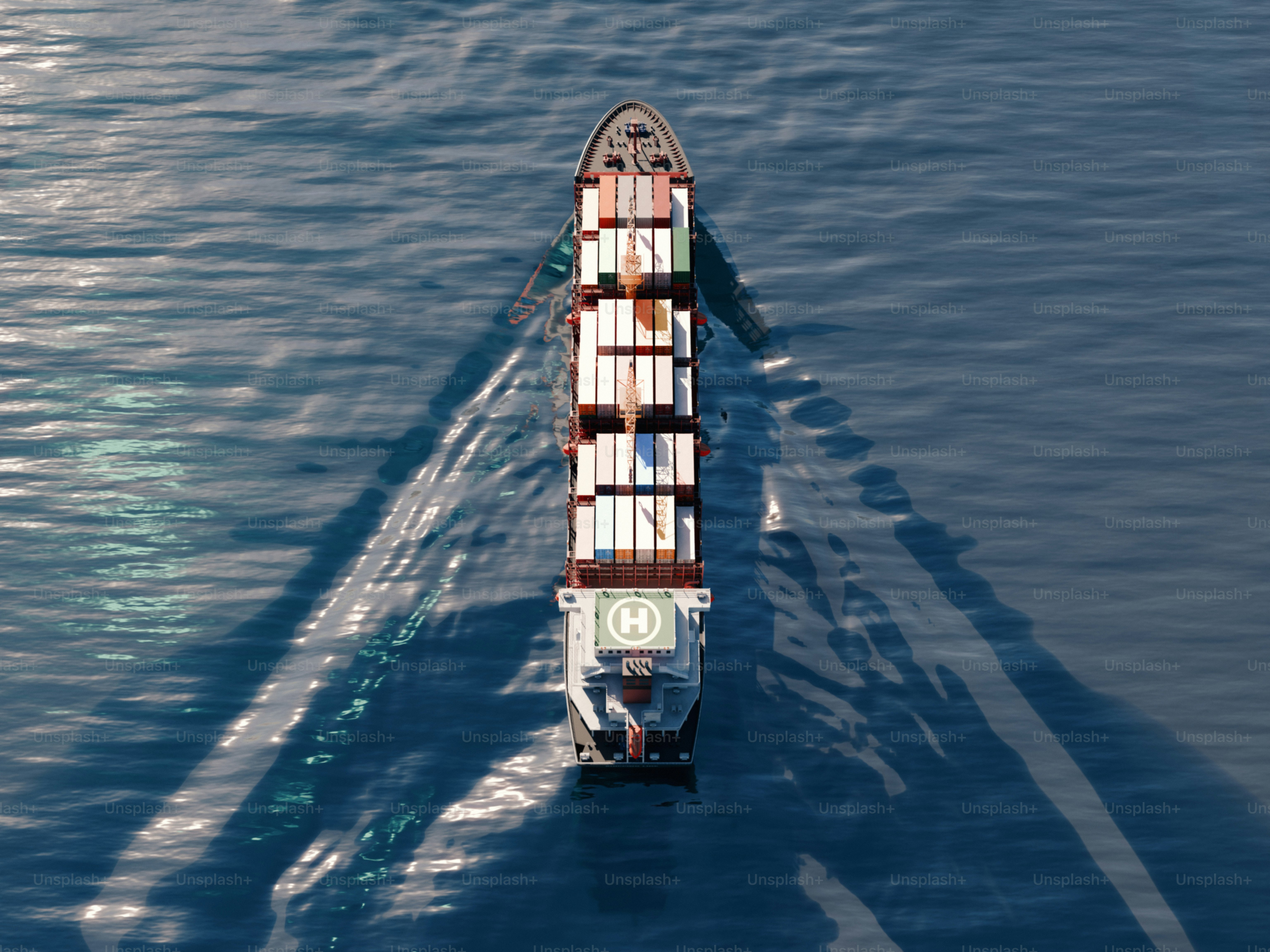 A cargo ship sails across the water.