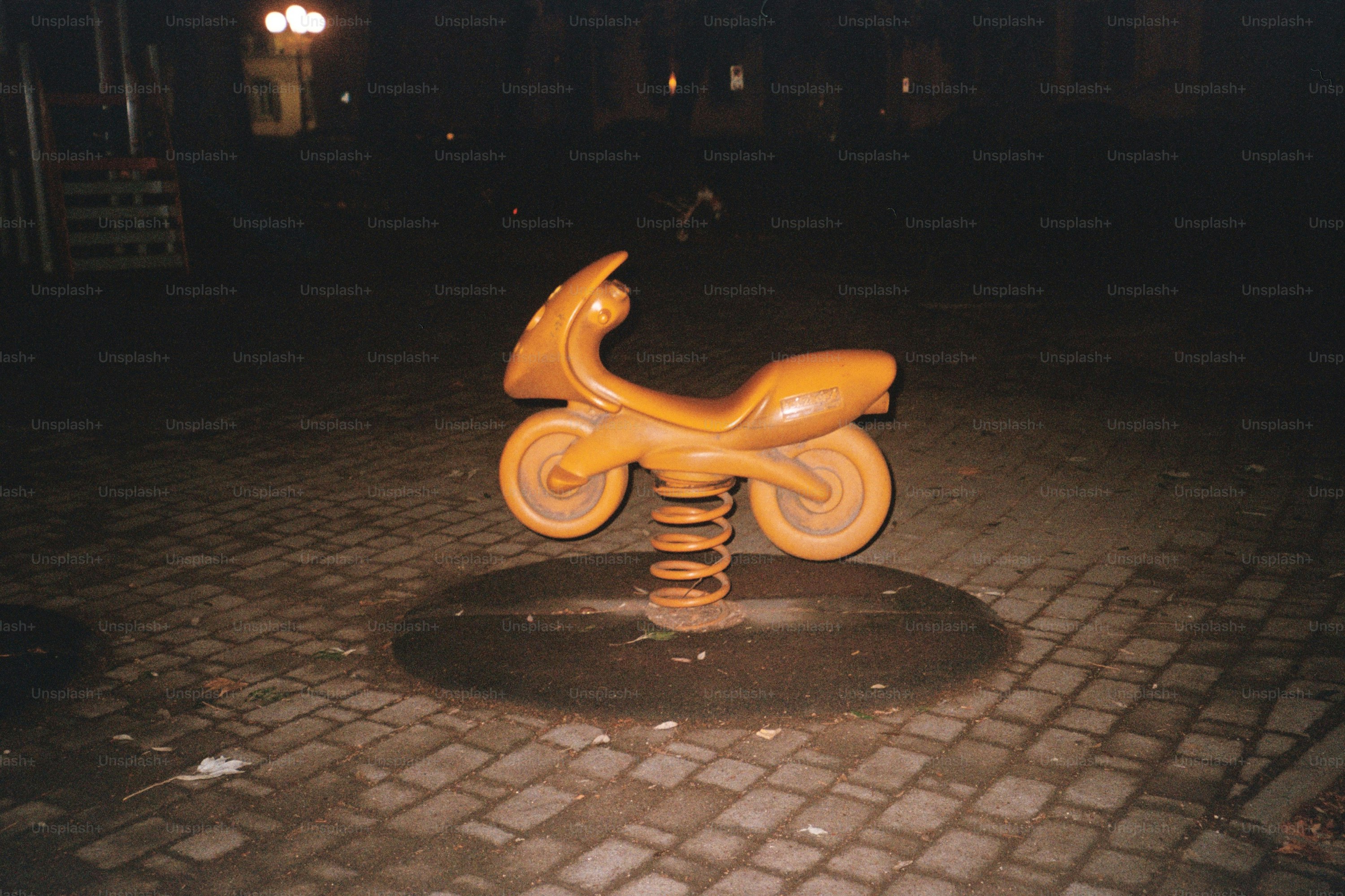 A playground spring toy of a motorcycle.