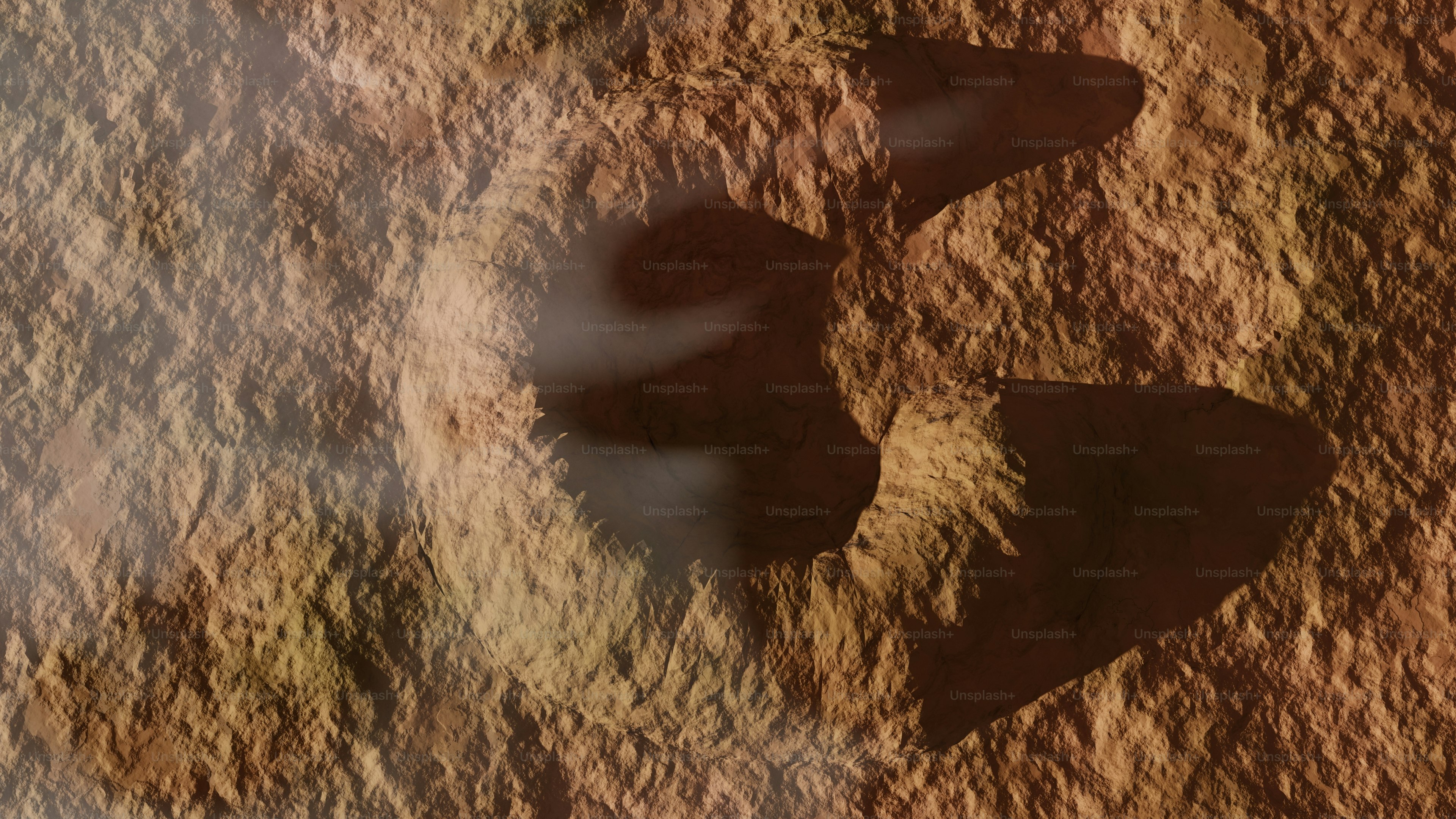 An aerial view of a large, eroded crater.