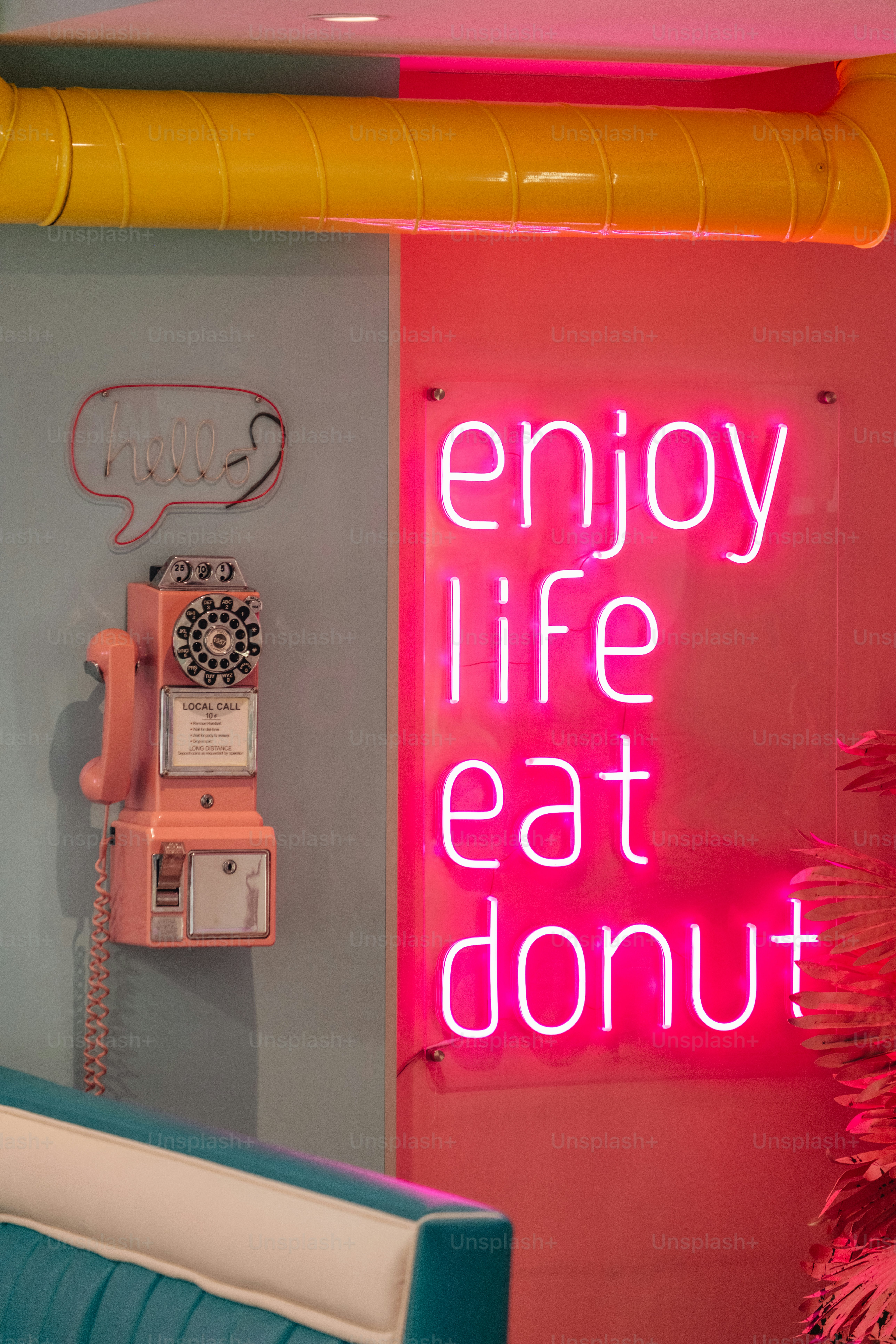 A neon sign encourages people to enjoy life.