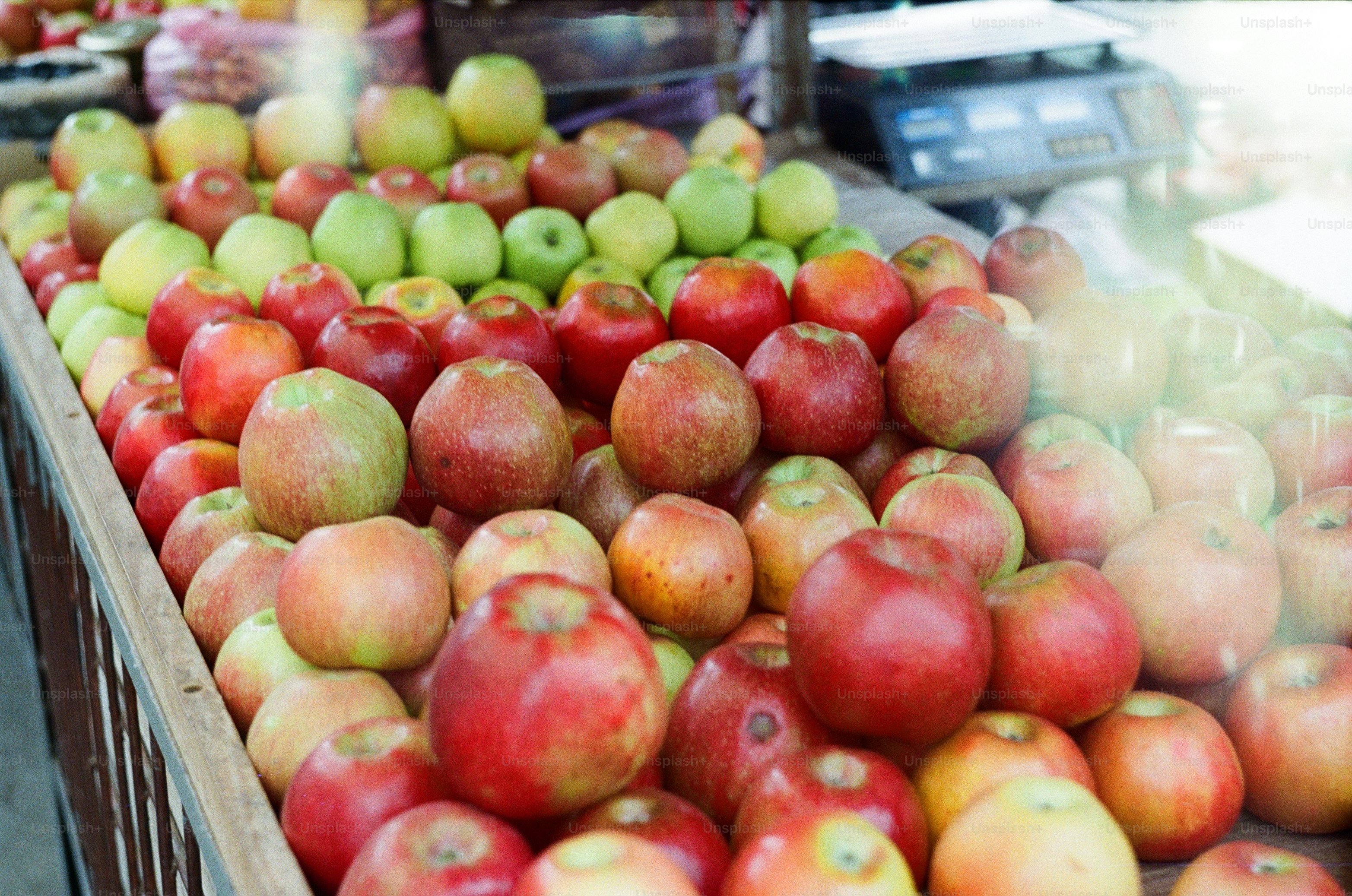 Apples of various colors are for sale.