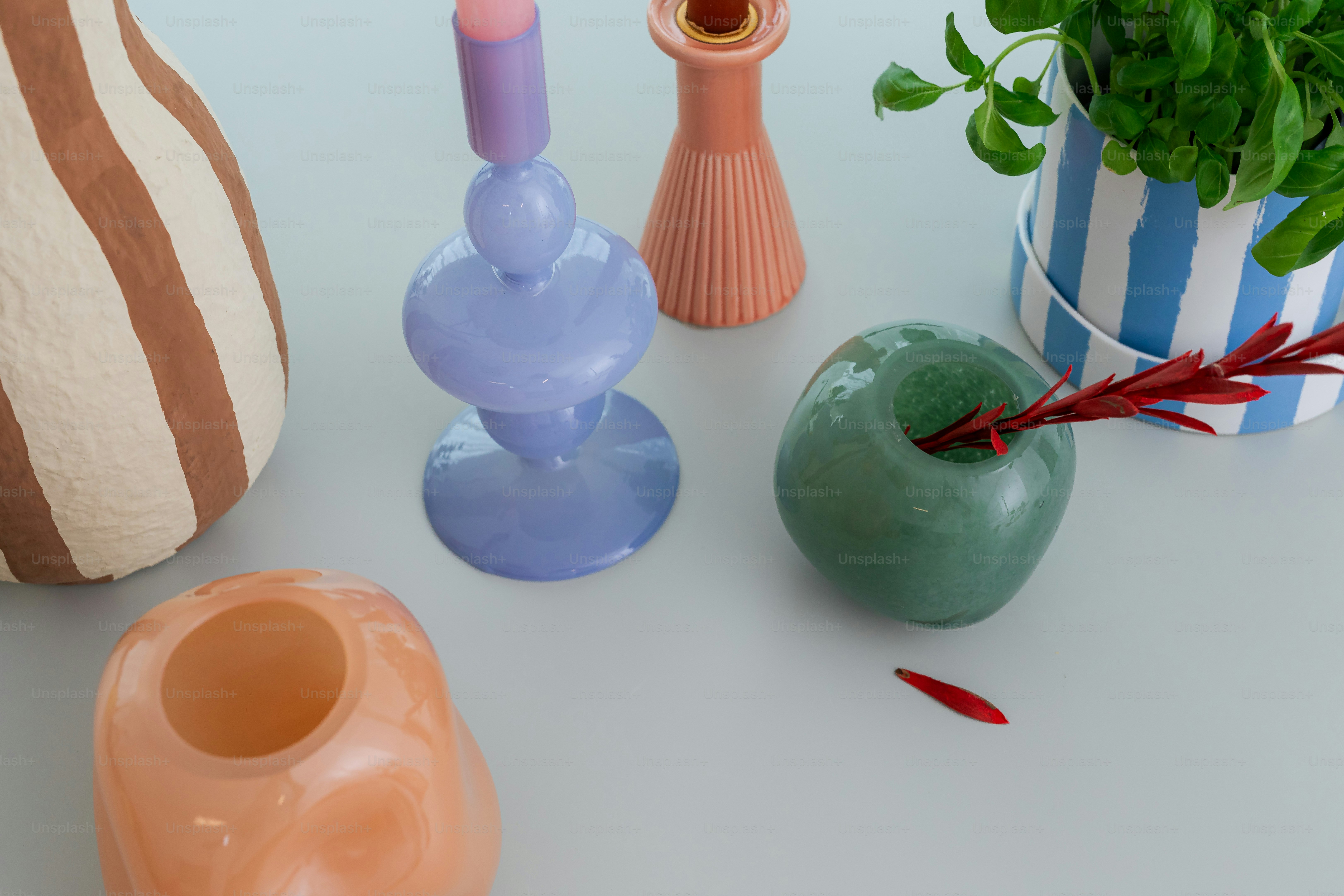 Decorated vases and objects are displayed on a surface.