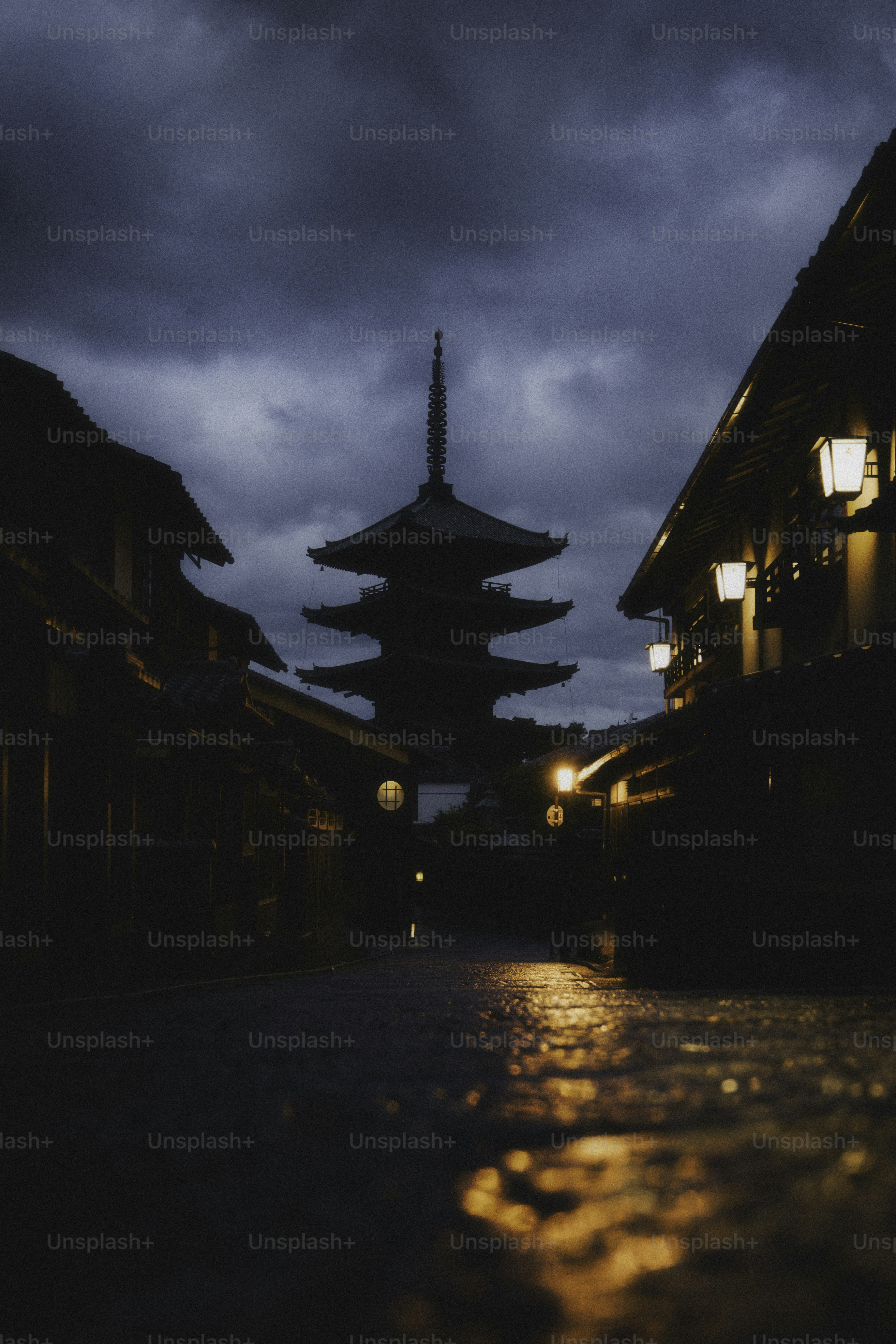 Dark japanese street with a pagoda at twilight.