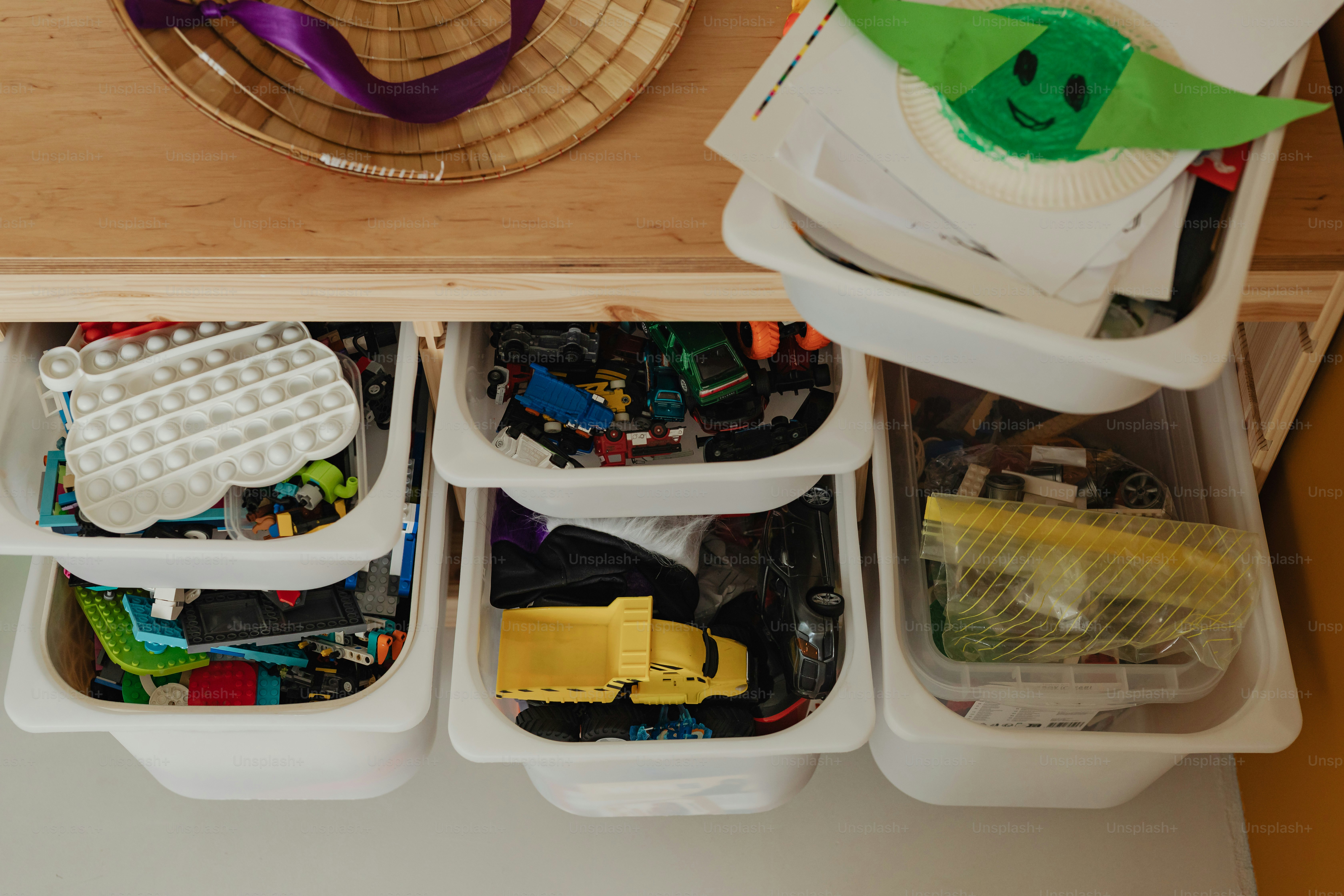 A cluttered closet full of folded clothes. photo – Laundry Image on ...