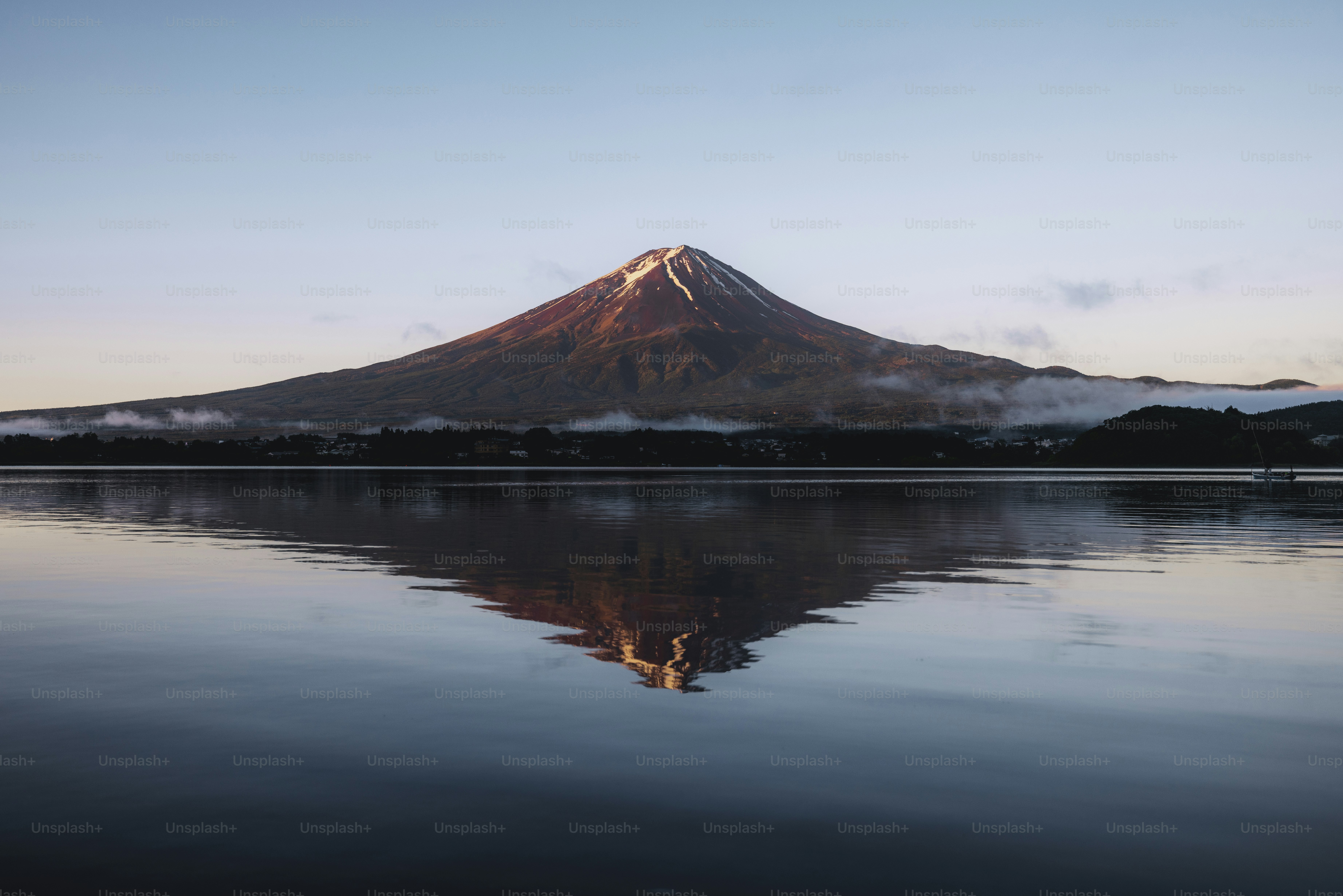 Mount fuji reflected in serene water.