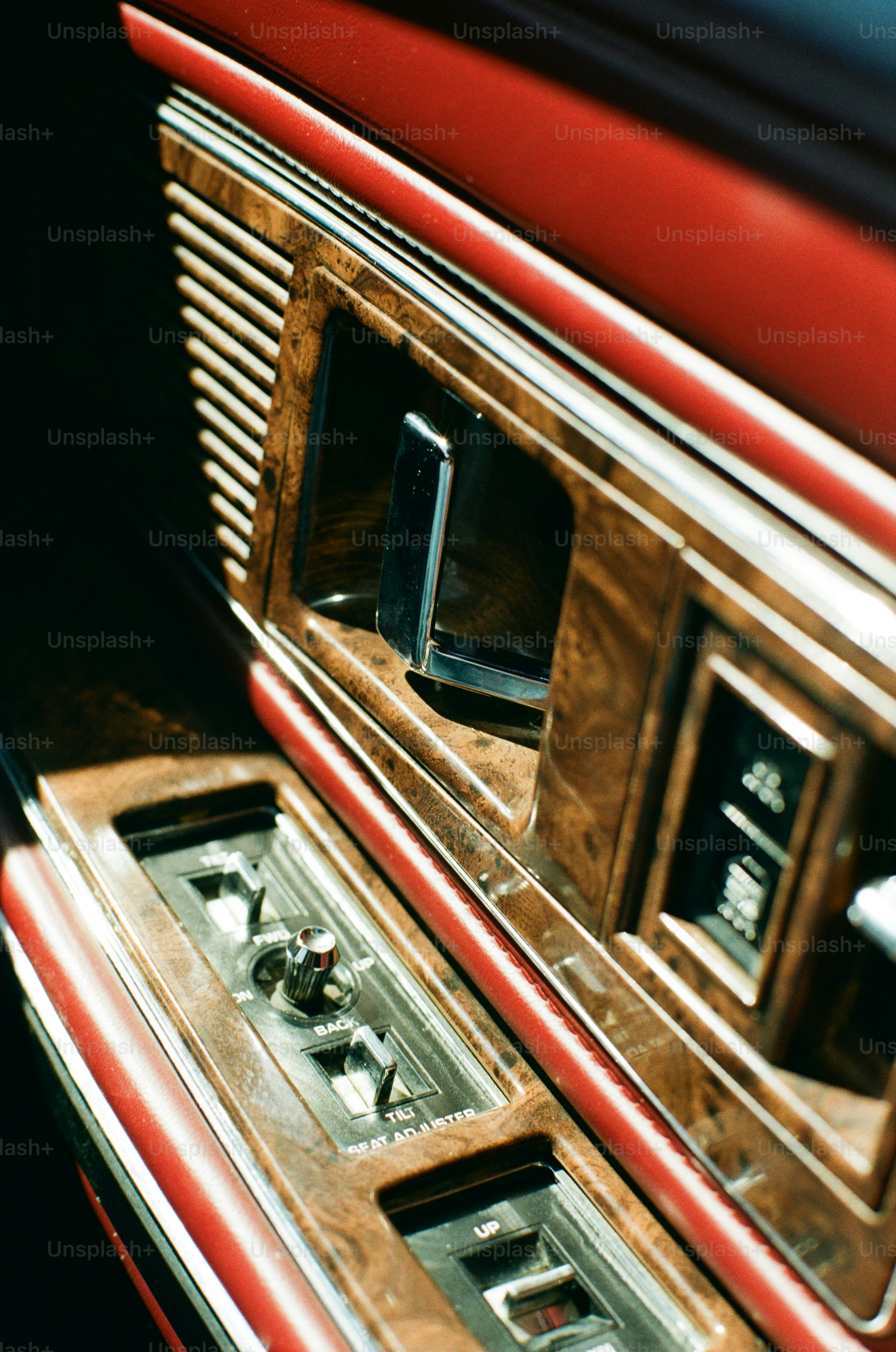 An antique car door's interior details are shown.