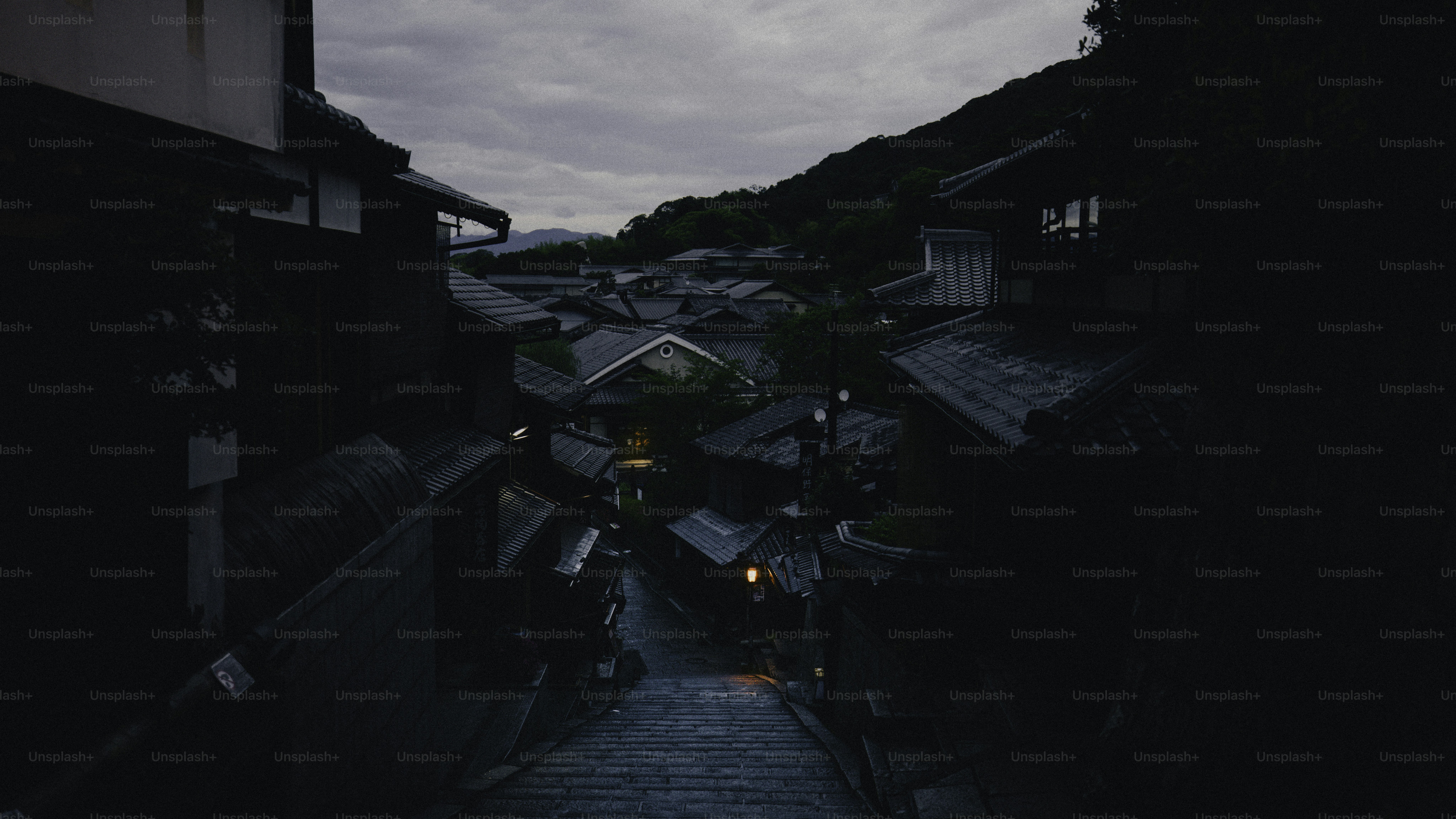Twilight descends on a japanese town's rooftops.