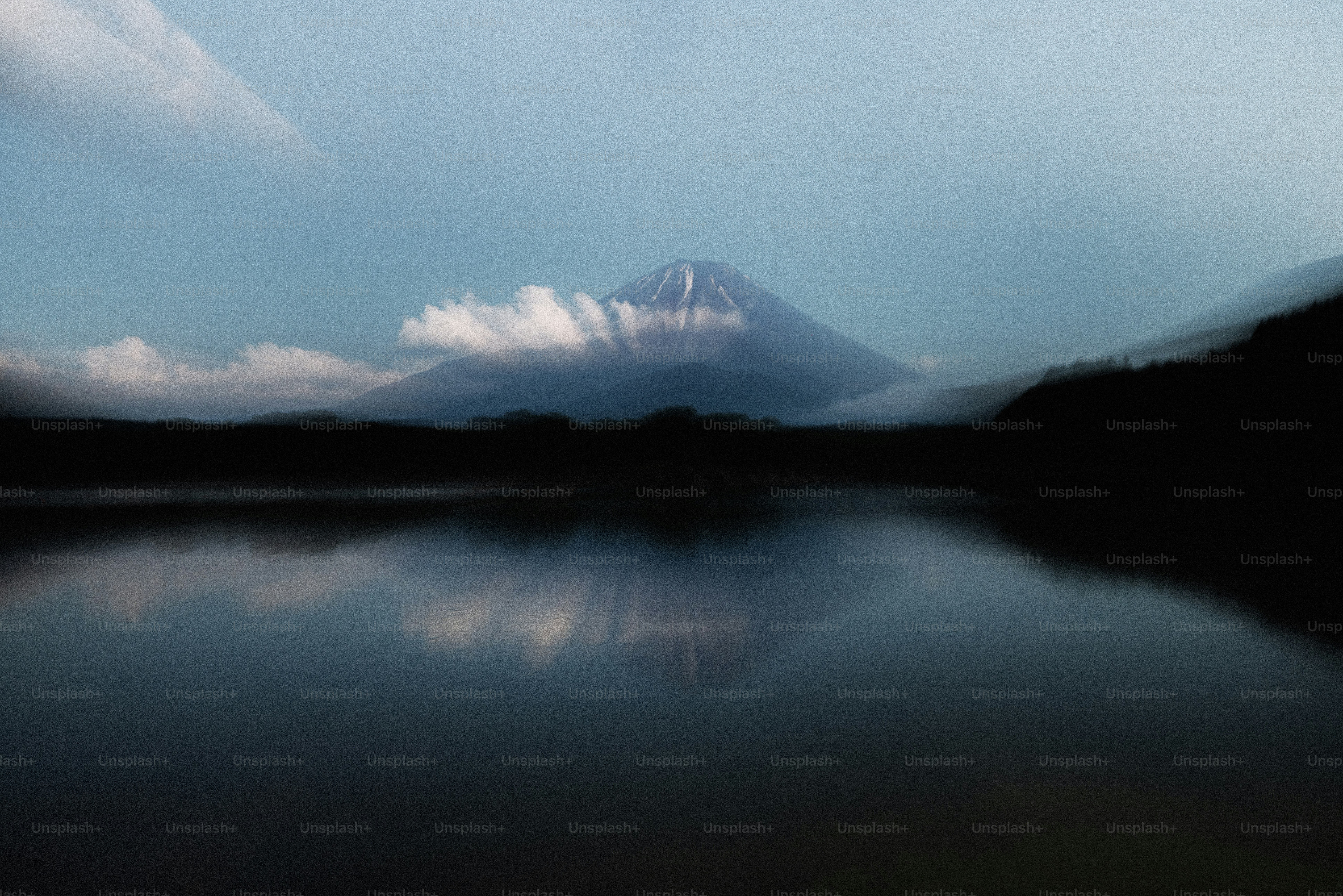 A majestic mountain reflected in a calm lake.