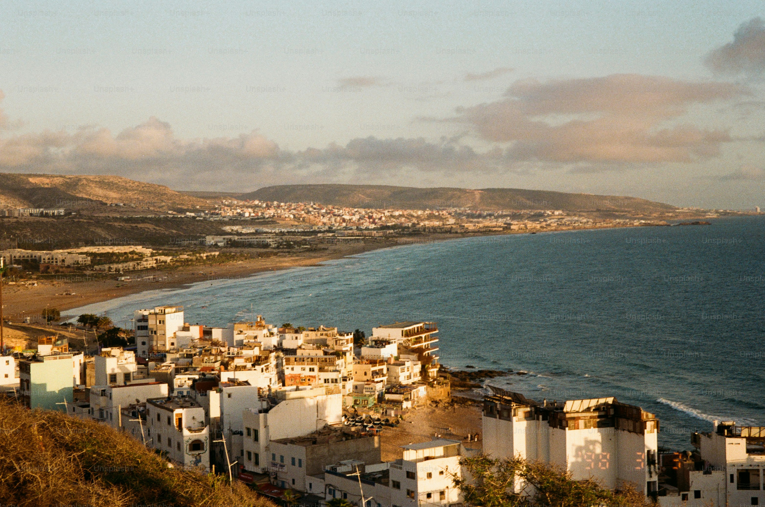 A coastal city sits beside a beautiful ocean.