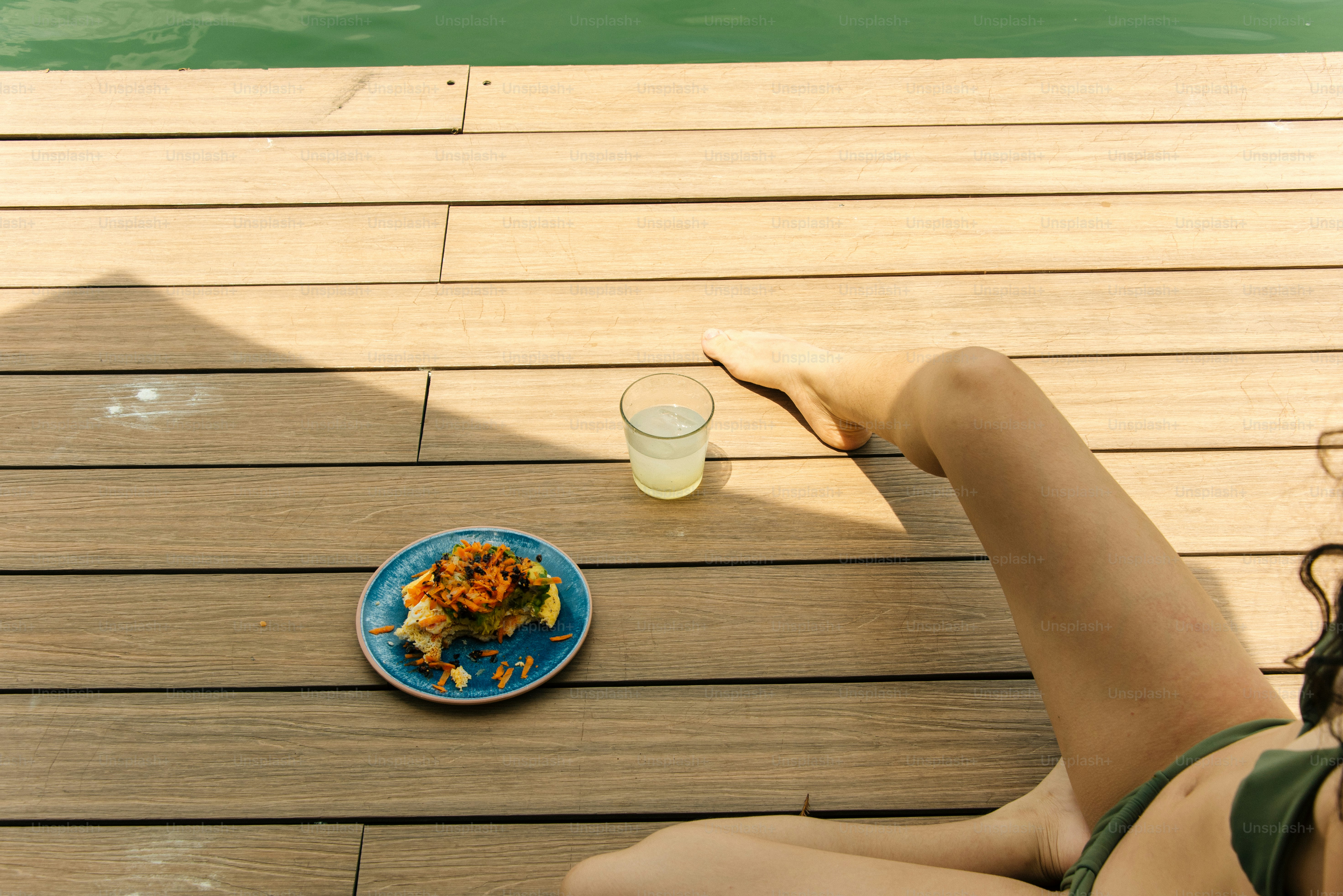 Relaxation with food and drink by the pool.