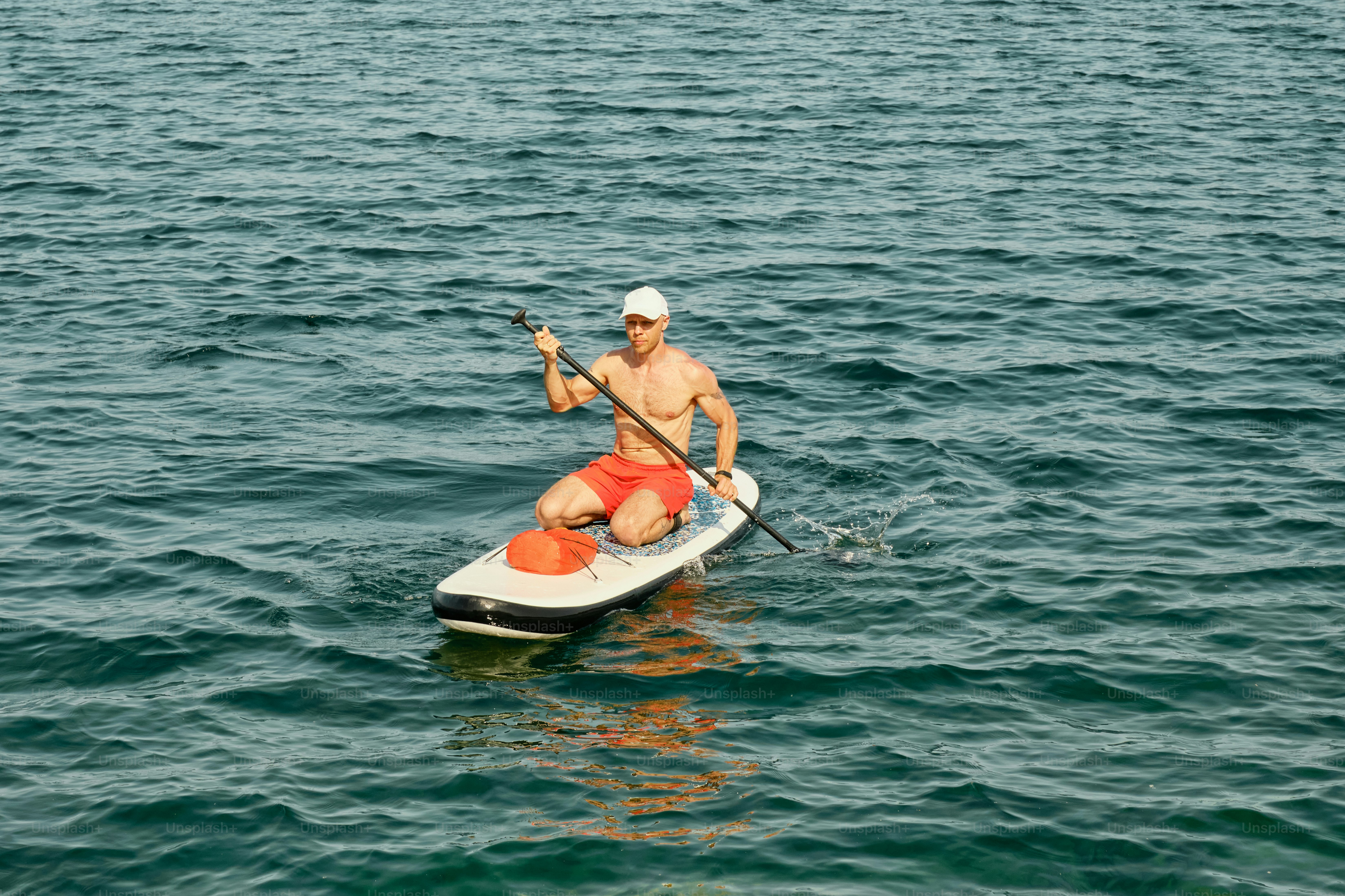 Gen X male model with supsurf on the mountain lake