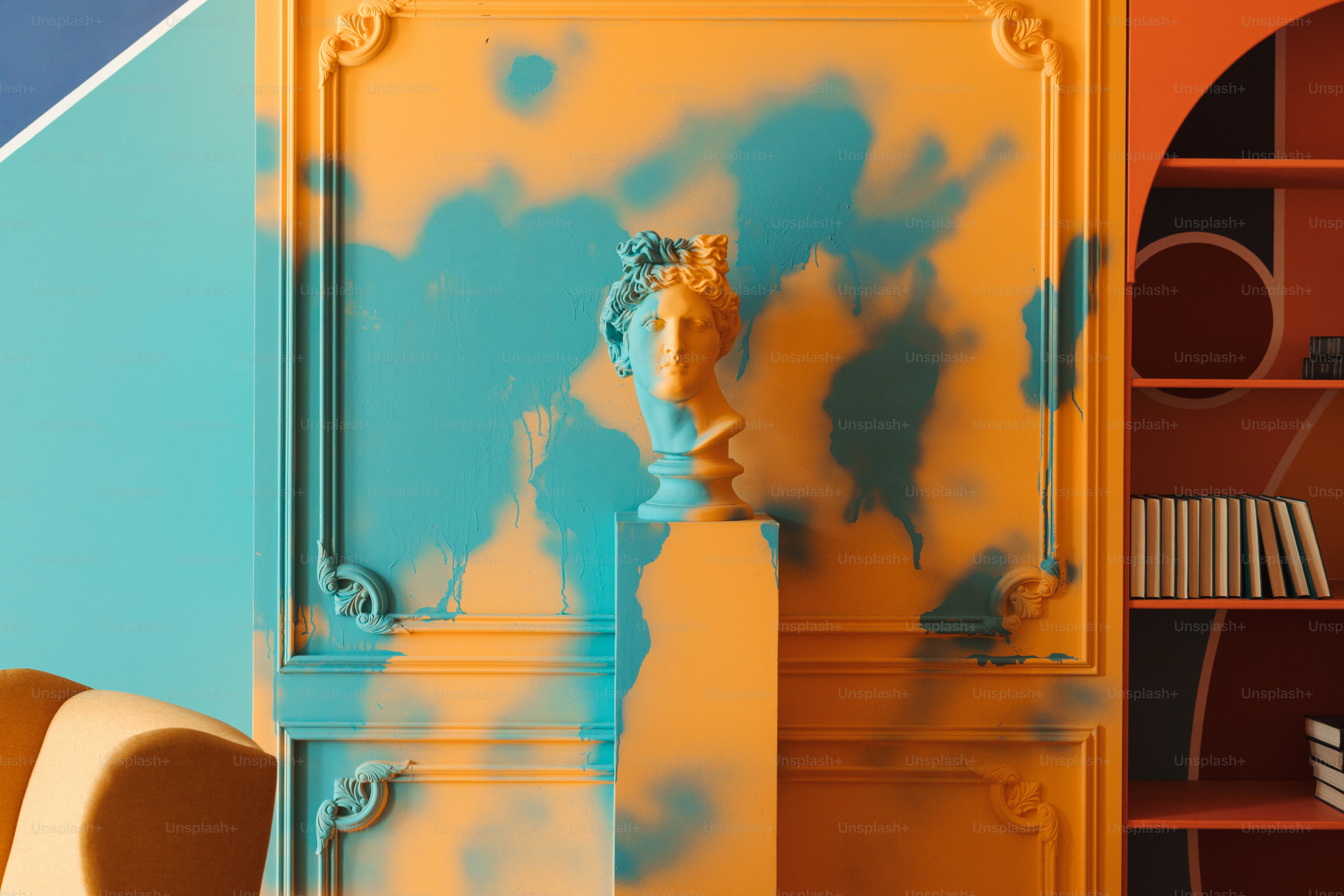 A colorful wall features sculptural art.