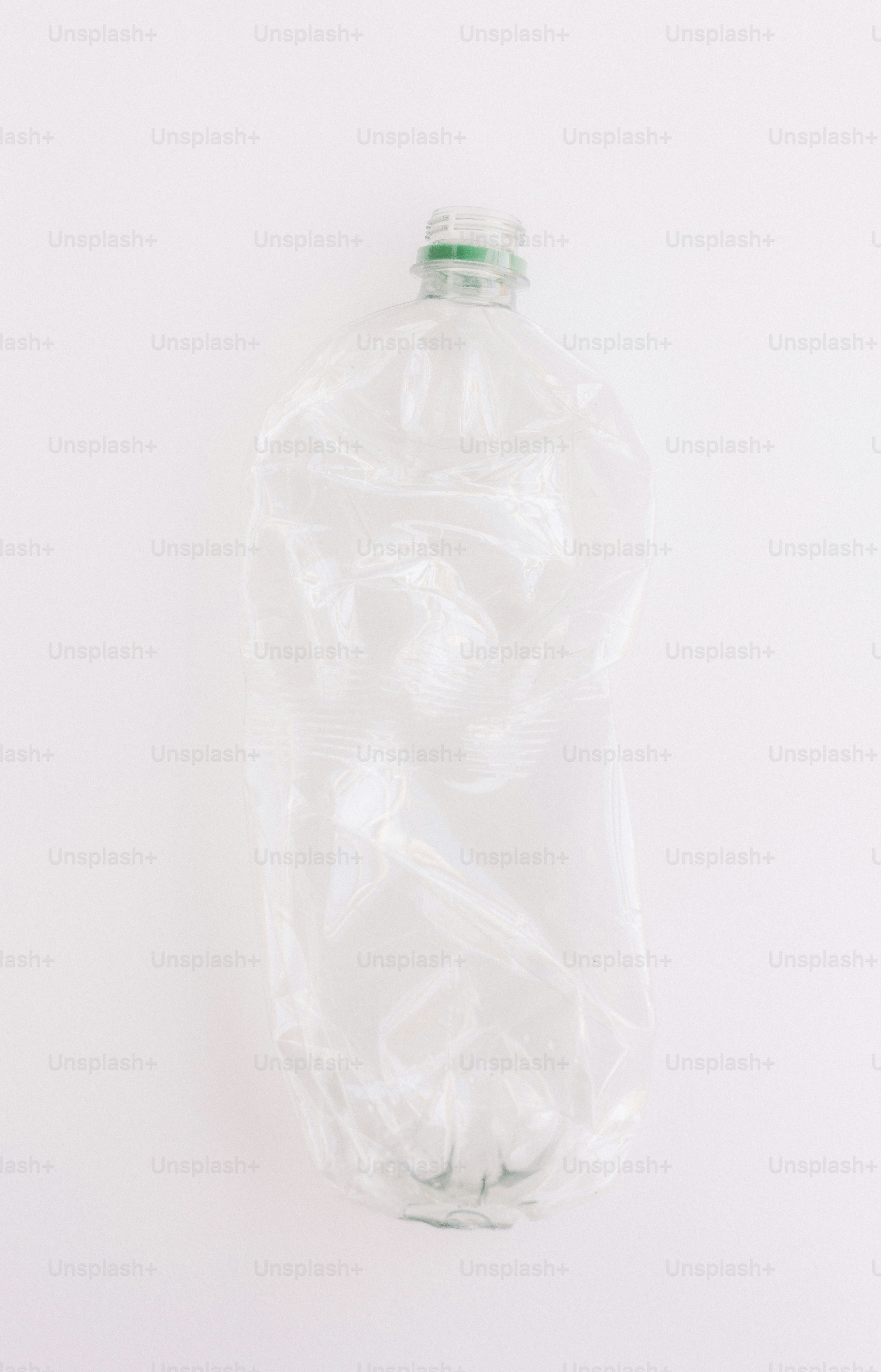 A crushed plastic bottle on a white background.