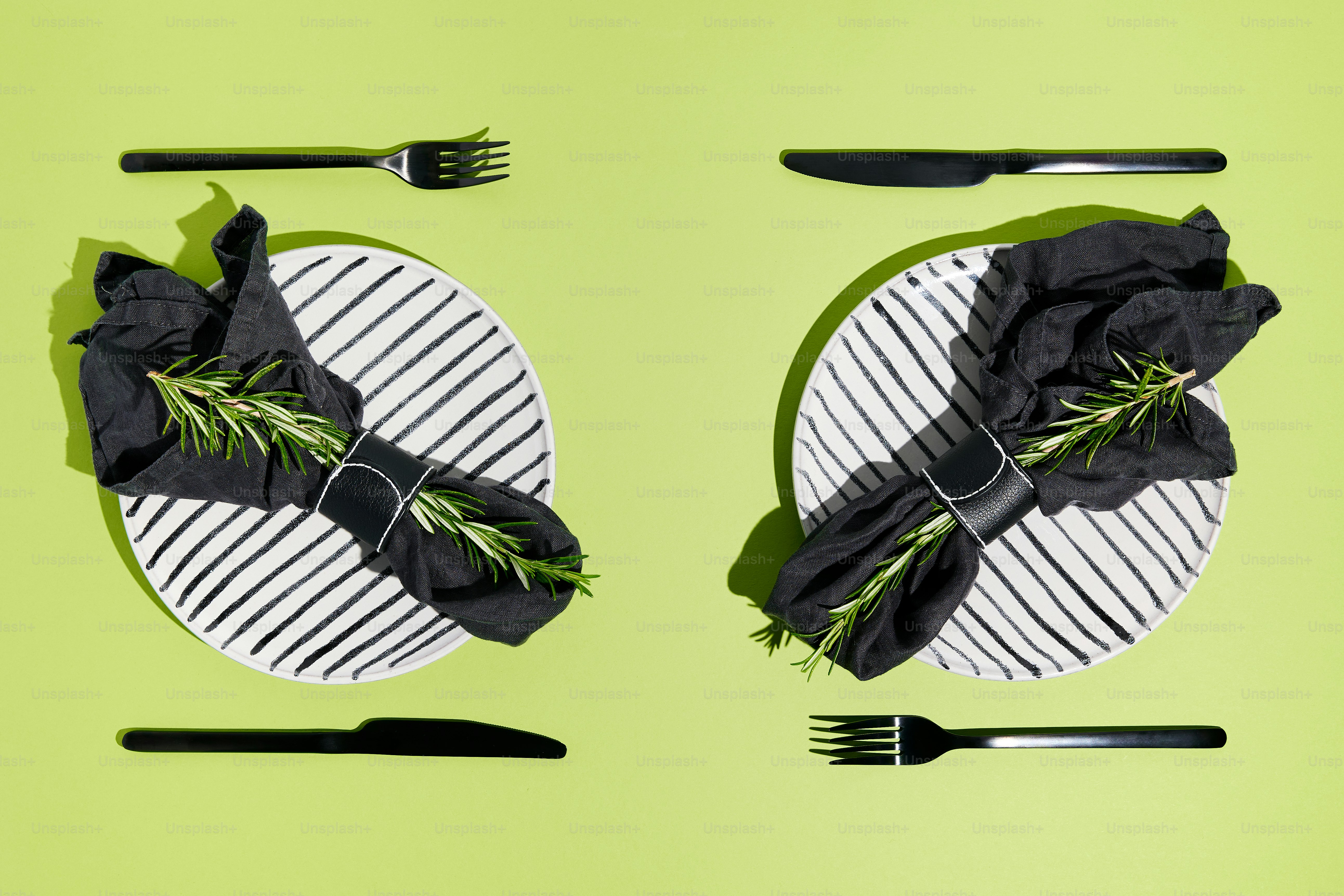 Plates and cutlery are set for a simple meal.