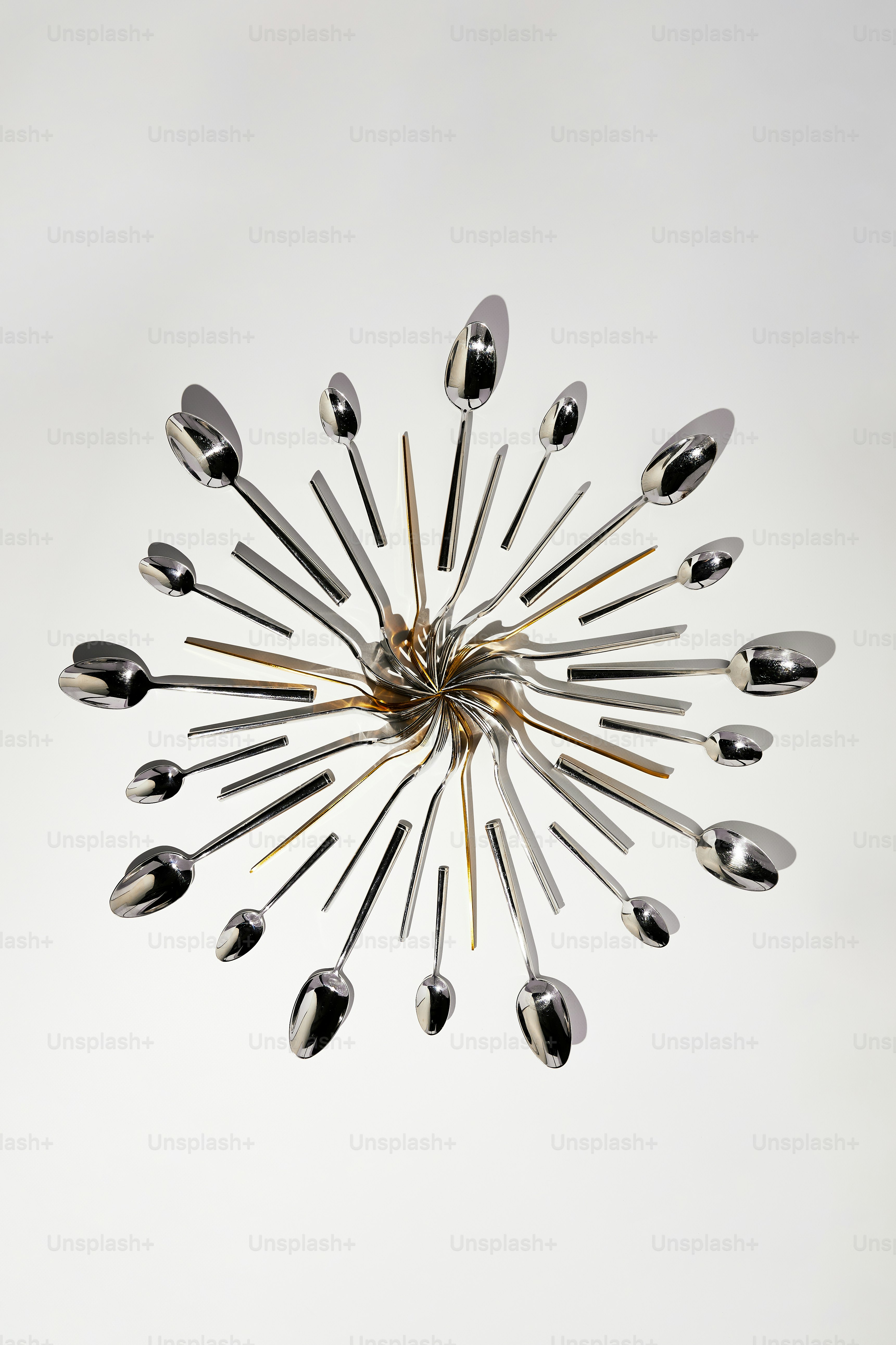 Spoons arranged in a radial pattern.