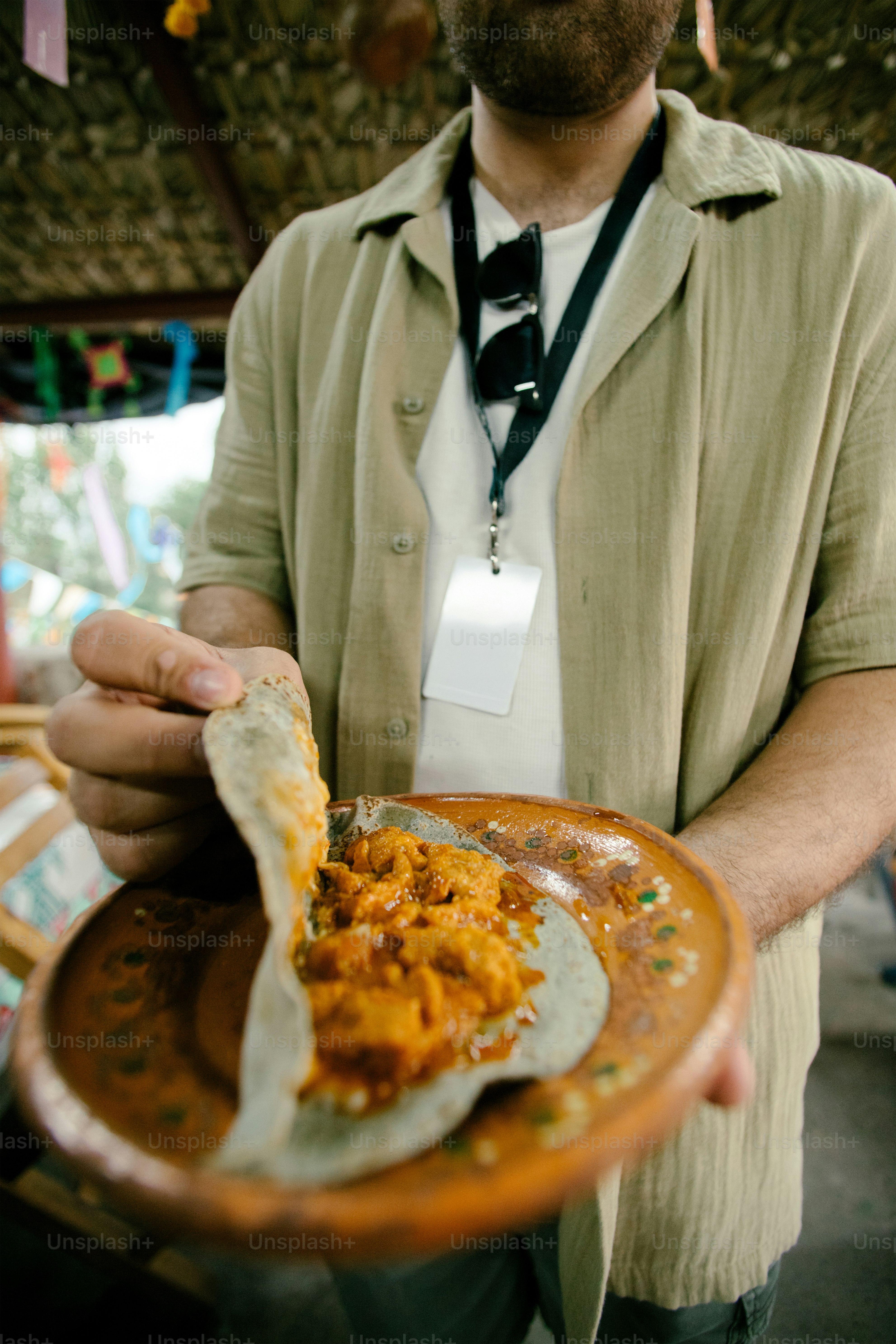 Man holds a taco with delicious filling.