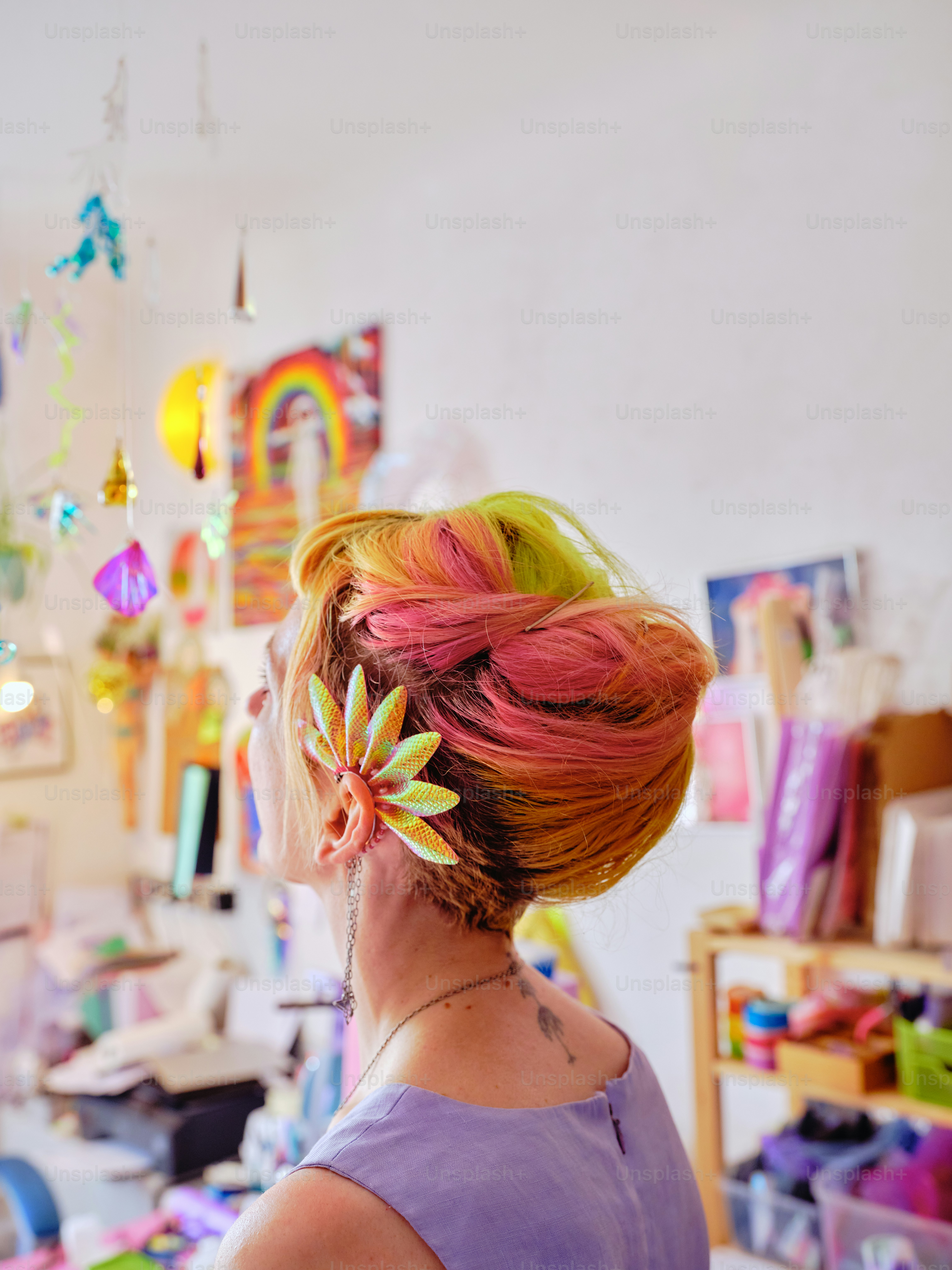 Styling colorful festival hair with neon wigs women before a rave