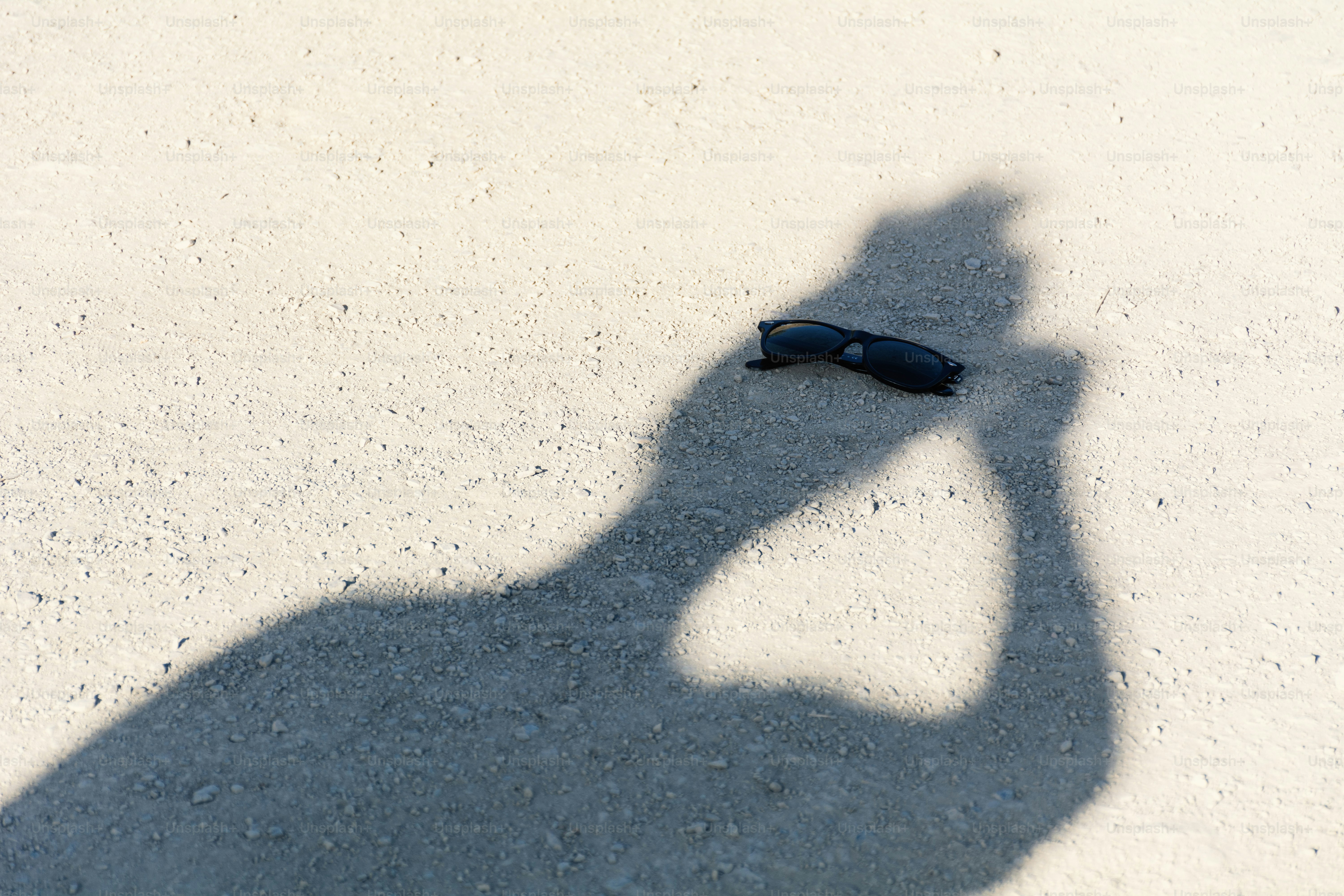 Shadows show a person jumping rope outside. photo – Abstract Image on ...