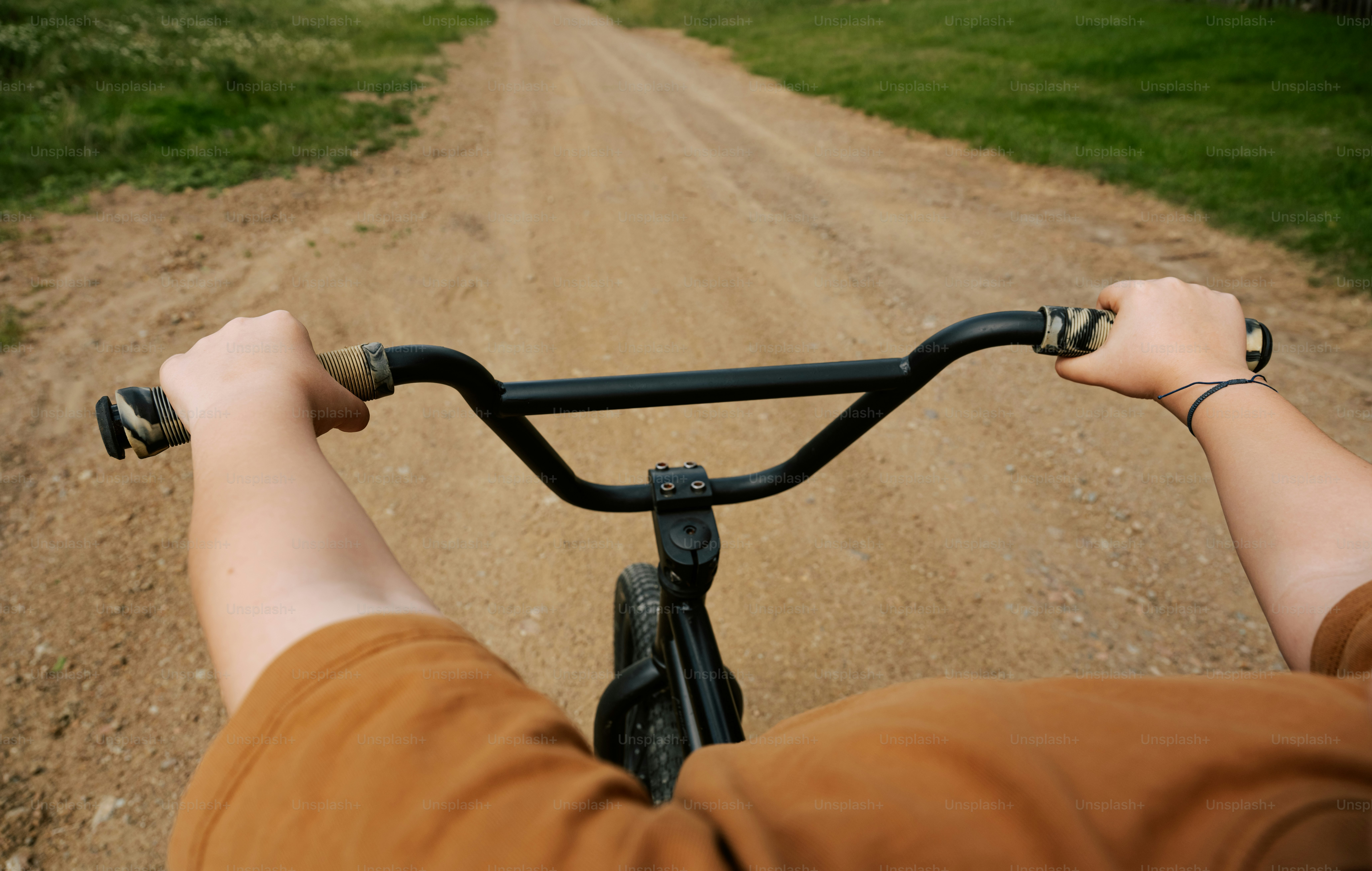 Rider's point of view on a dirt path.