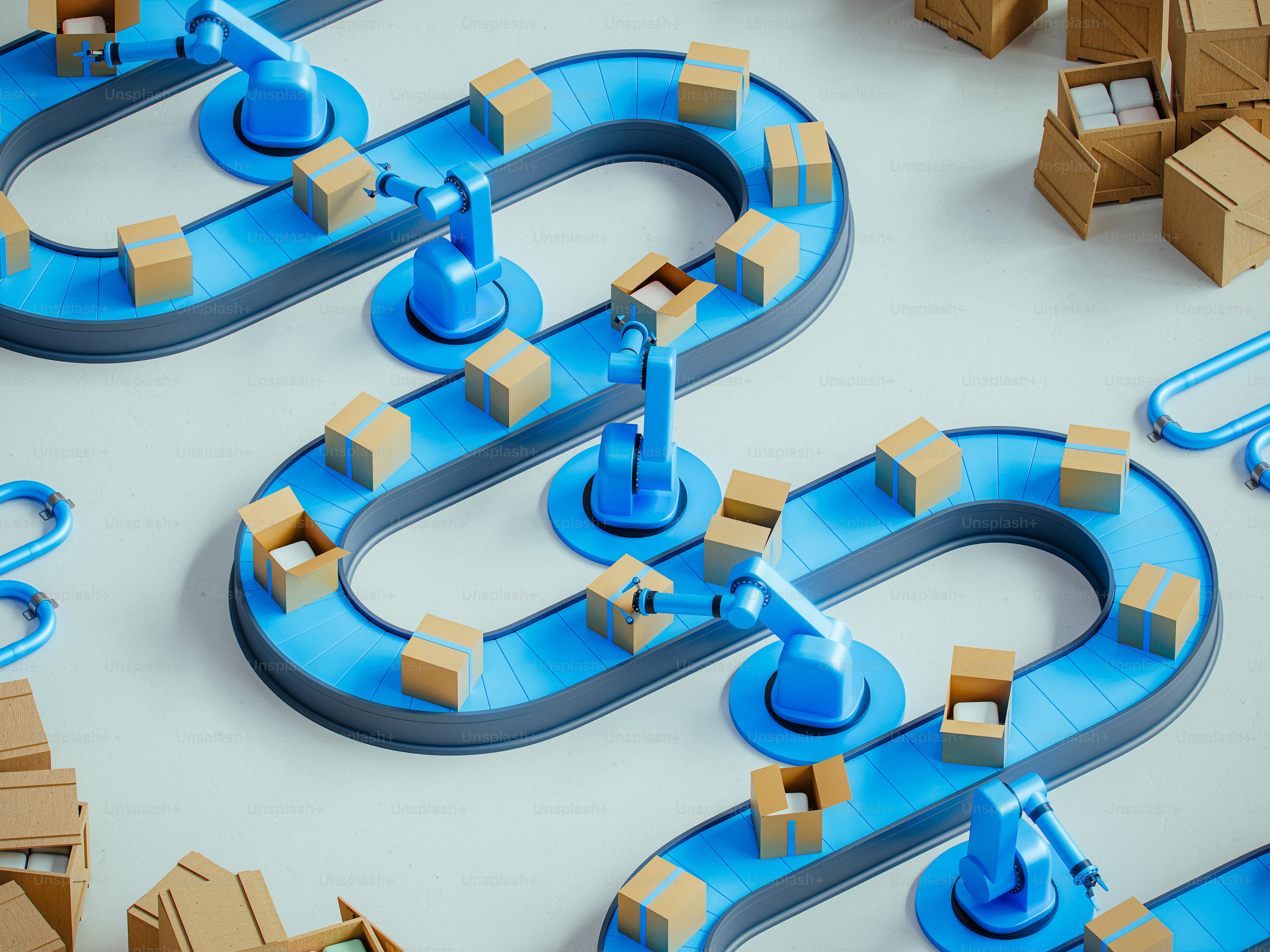 Robotic arms load boxes on assembly lines.