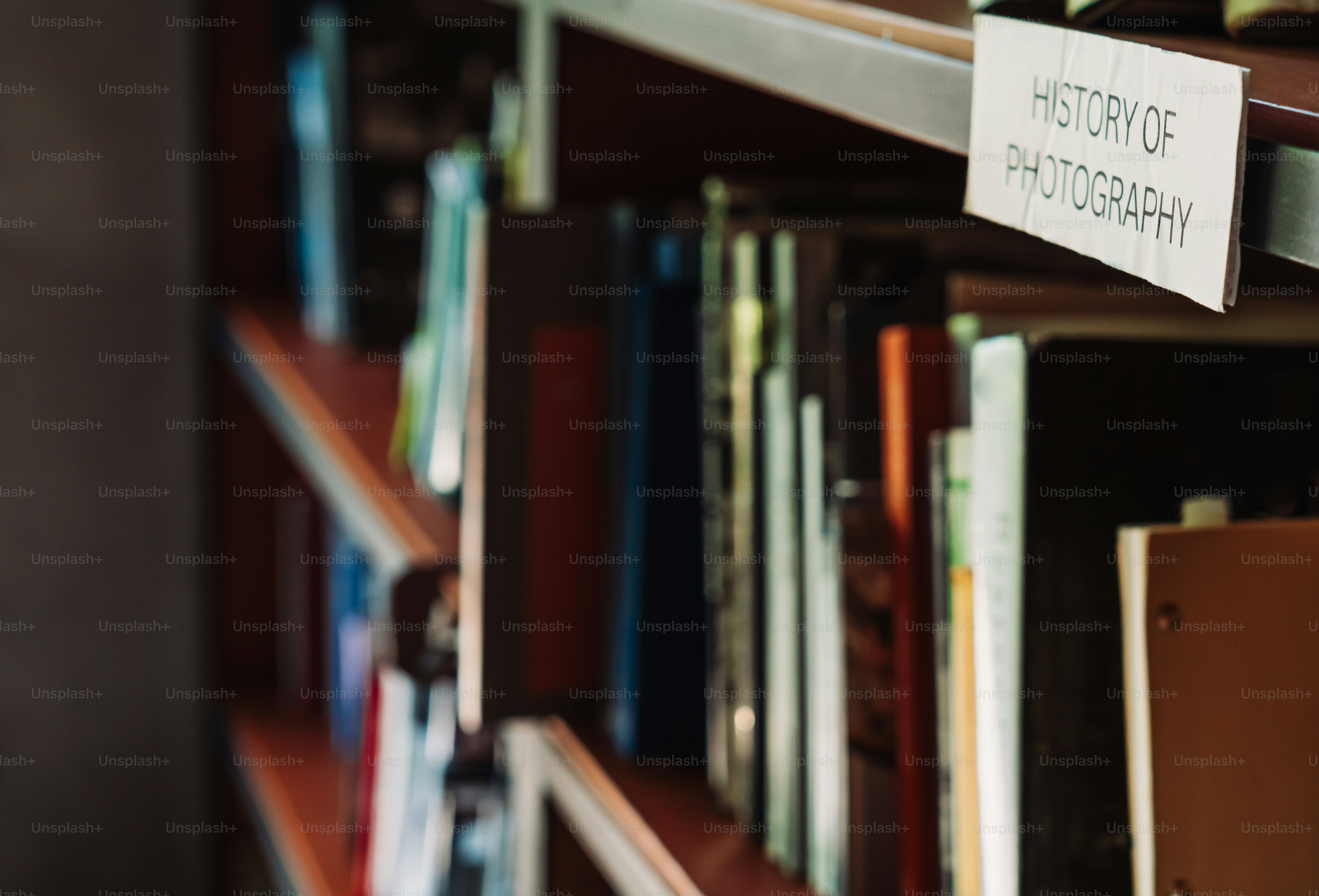 Books about the history of photography on a shelf.