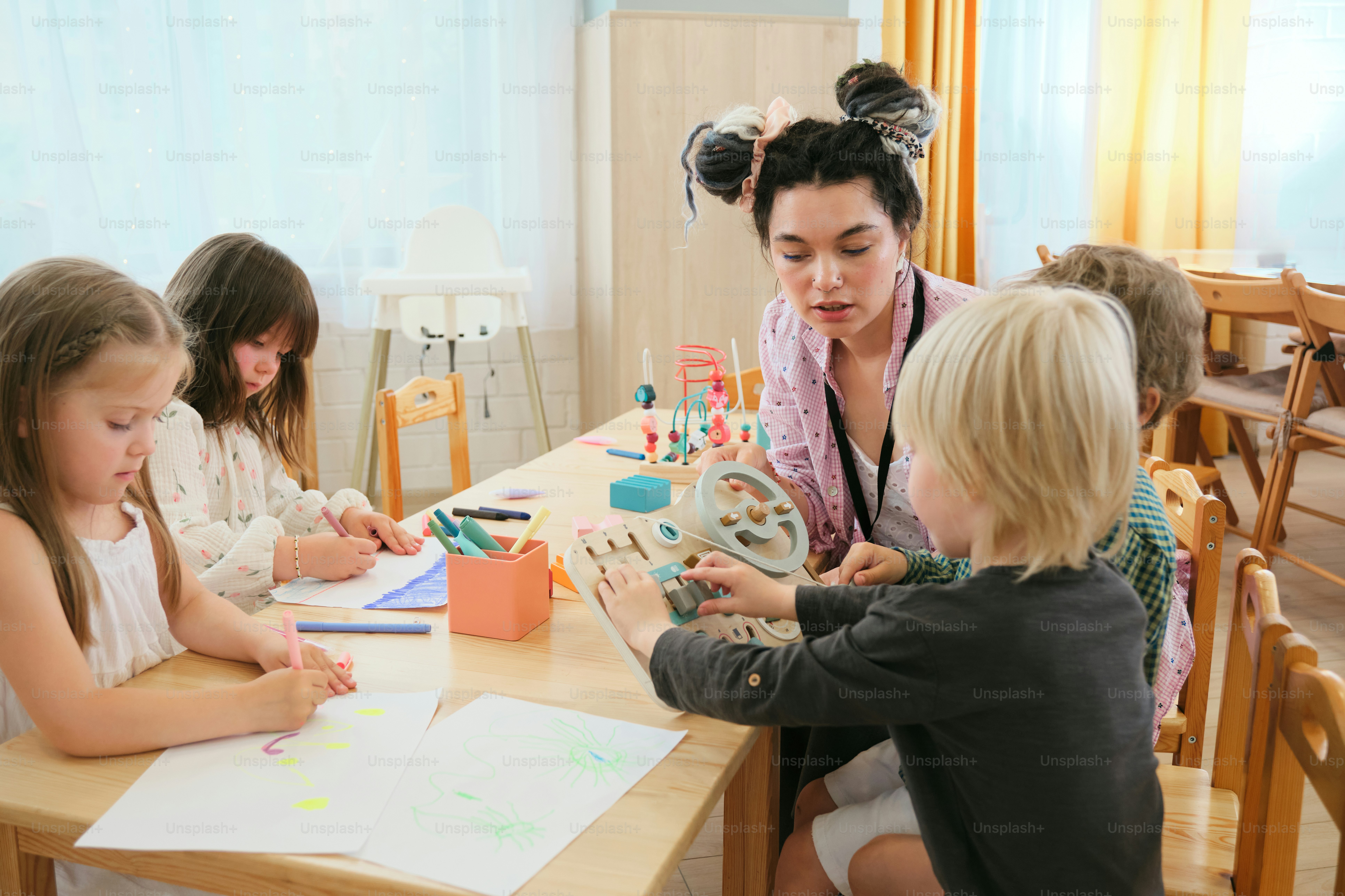 play and learning activities in modern daycare setting with multiple children
