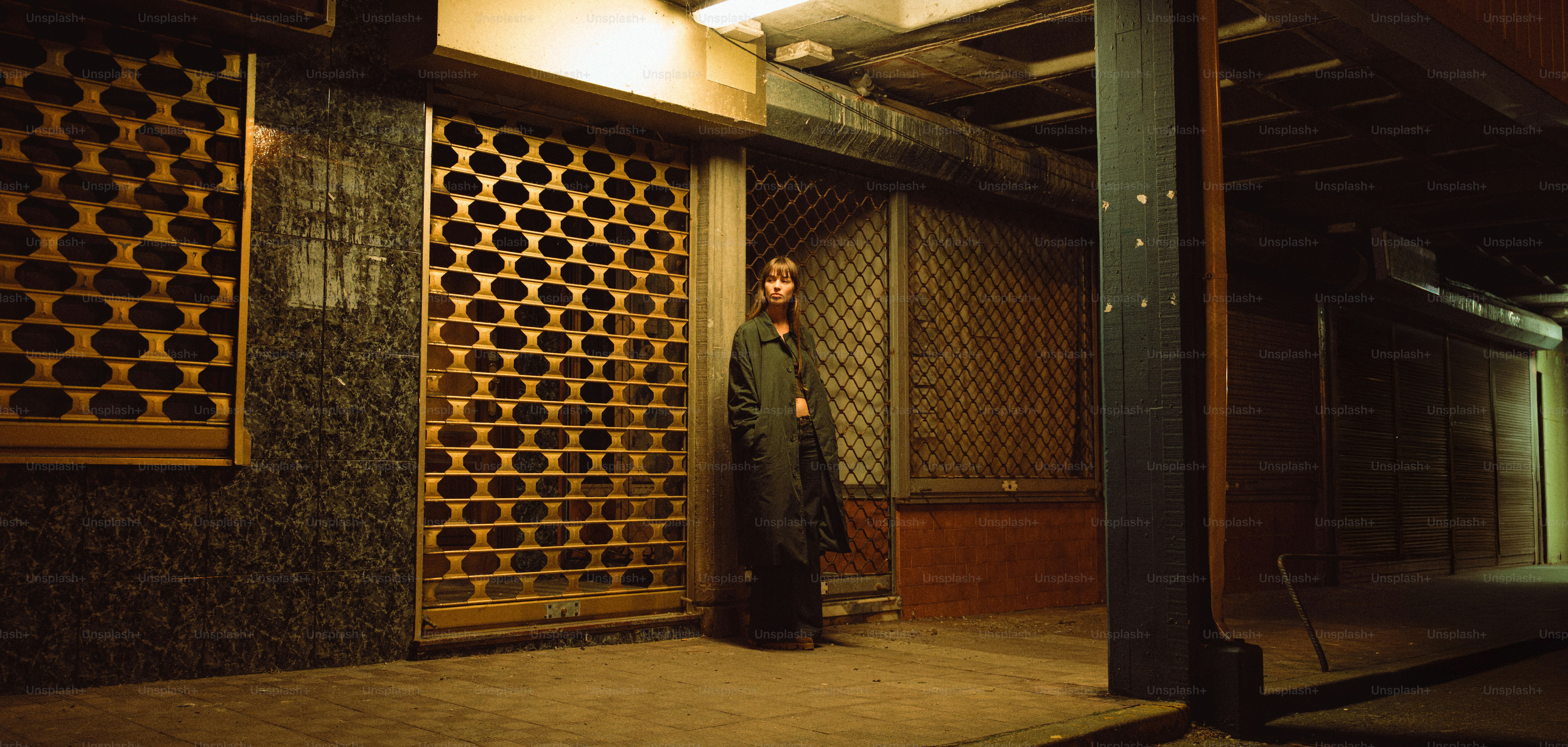 A person stands in a dimly lit alleyway. photo – Cinematic Image on ...