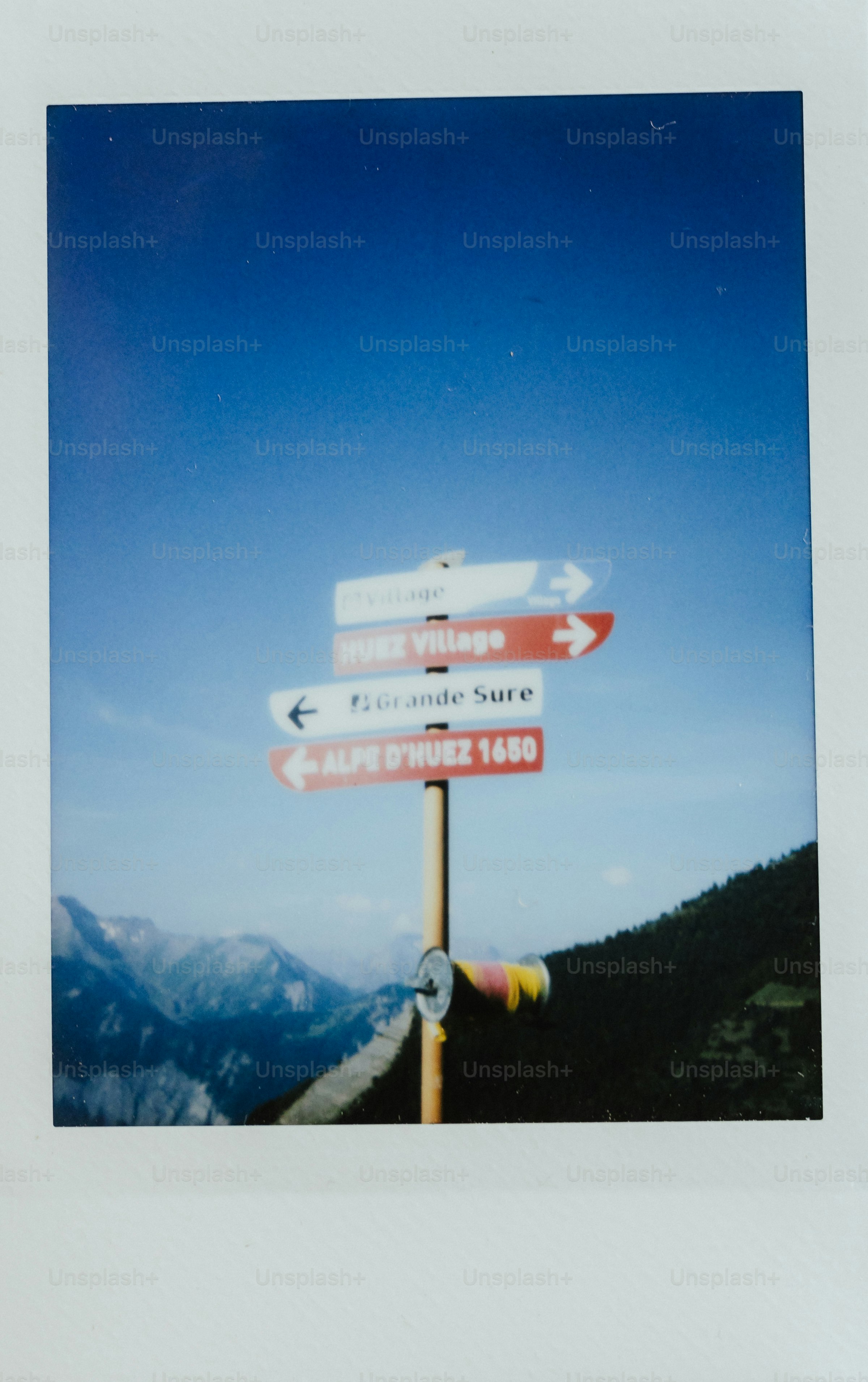 Directional signs point to various destinations.