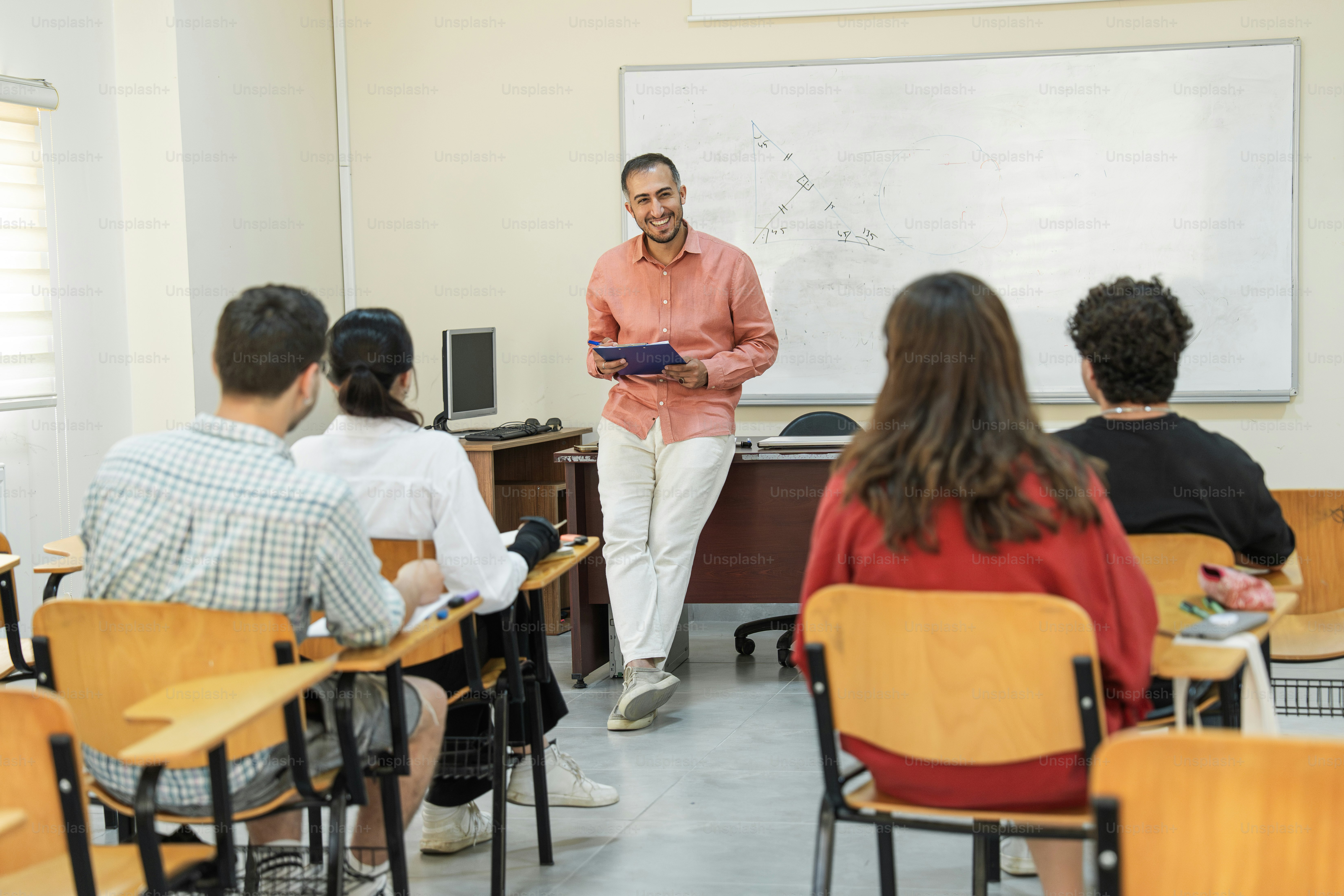 Teachers interact with students during class