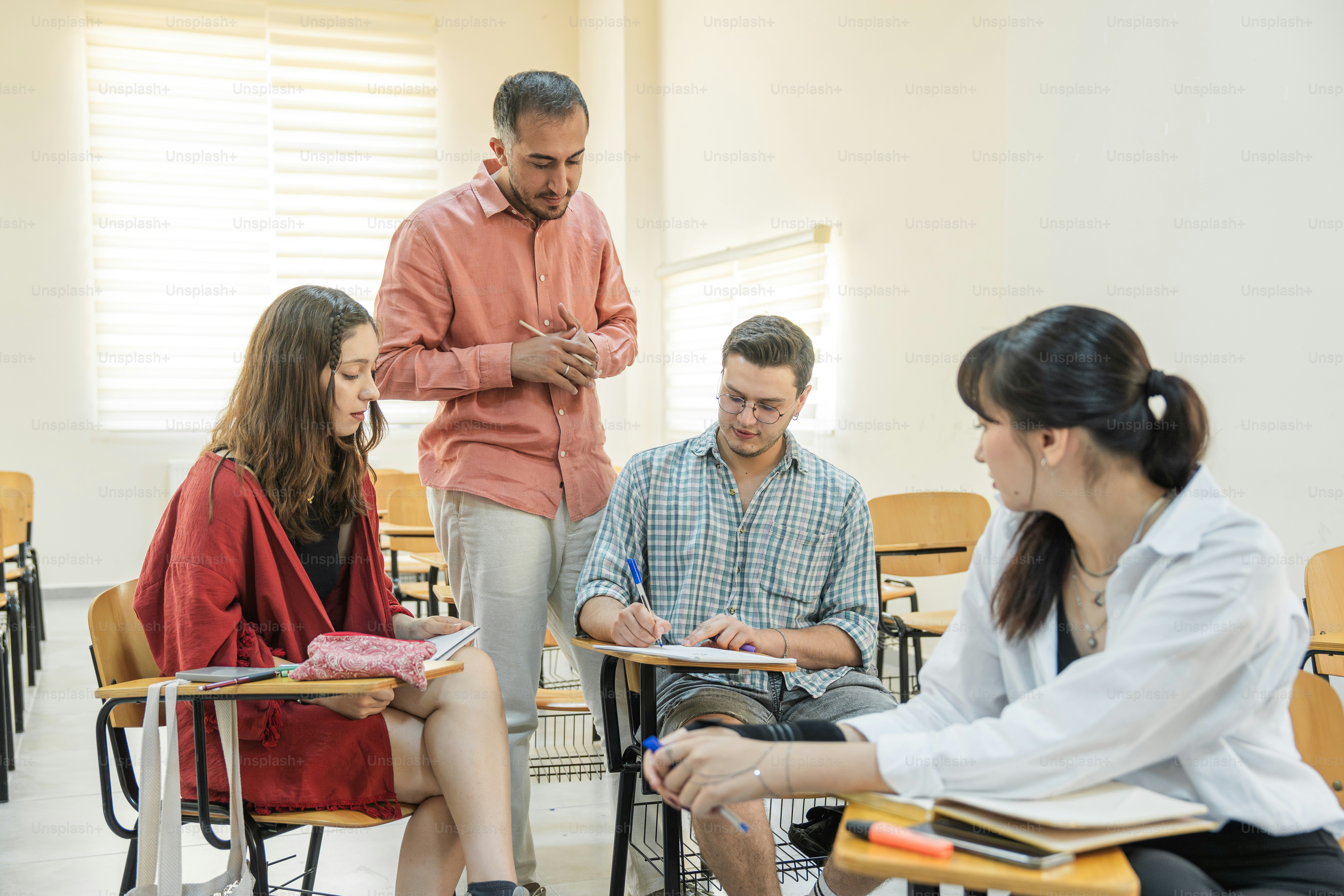 Students and instructor are interacting in a classroom. photo ...
