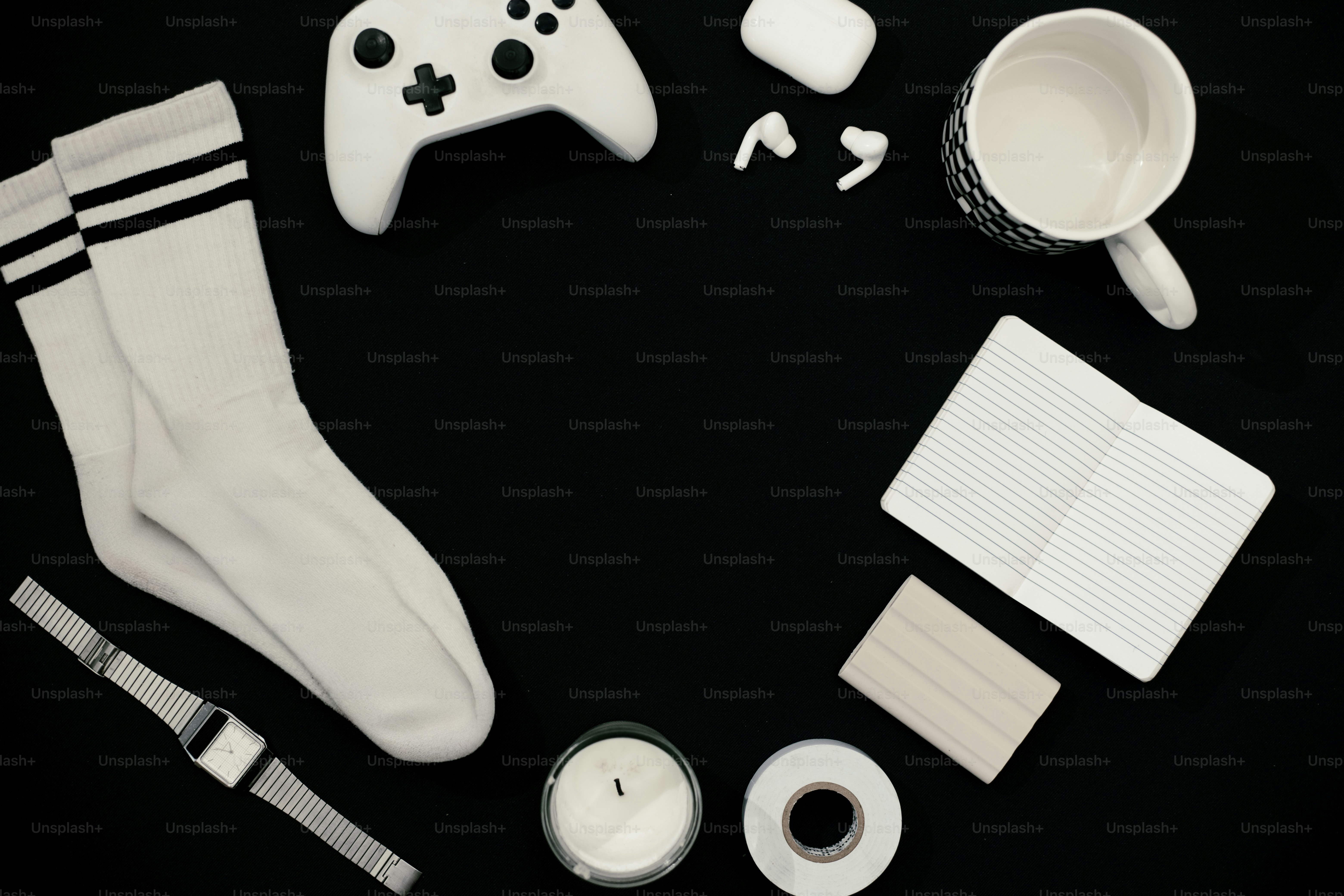 White objects arranged in a circle on a black background.