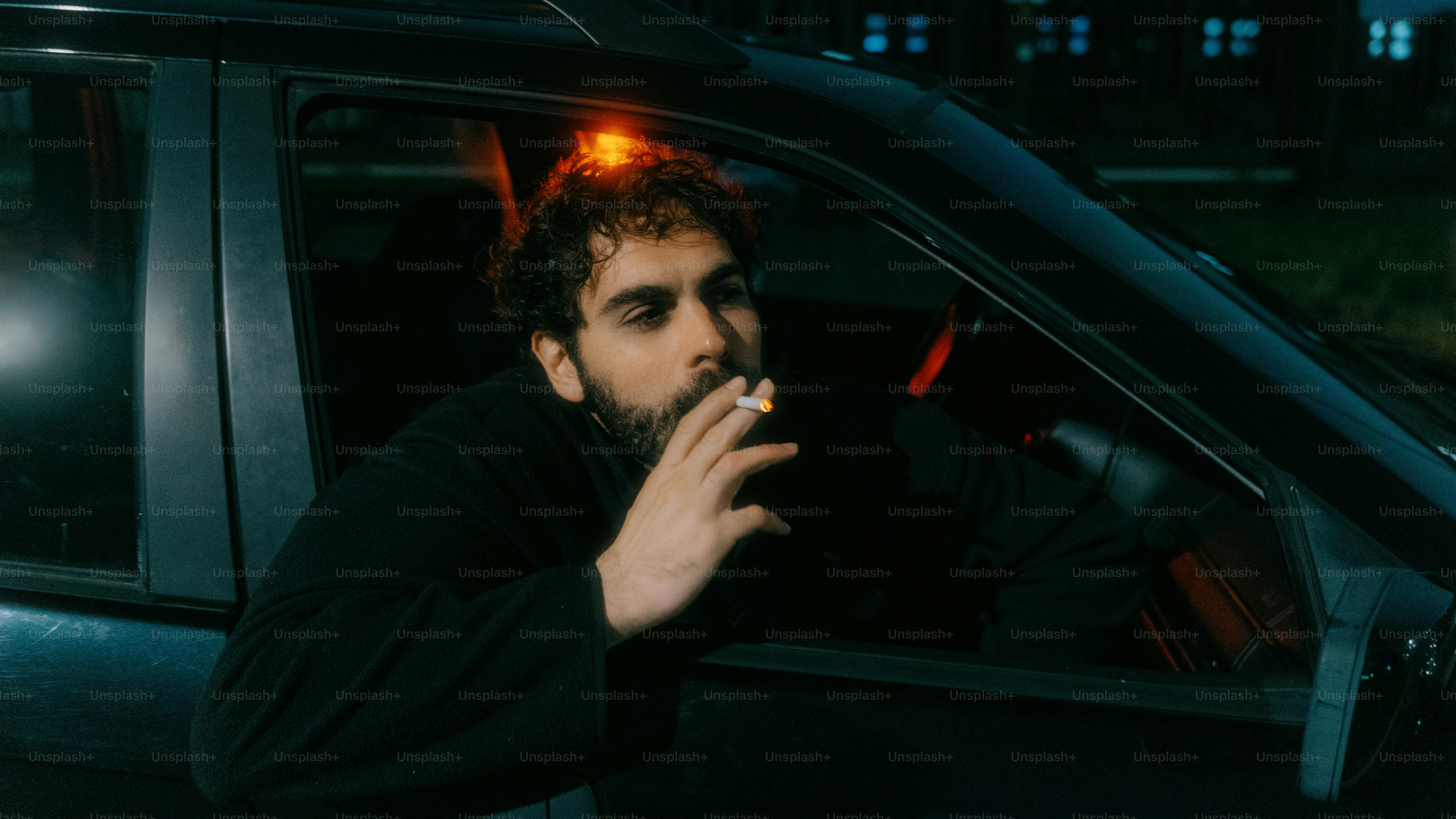 car smoking cigarette Man in a car smokes a cigarette at night. photo – Car Image on Unsplash