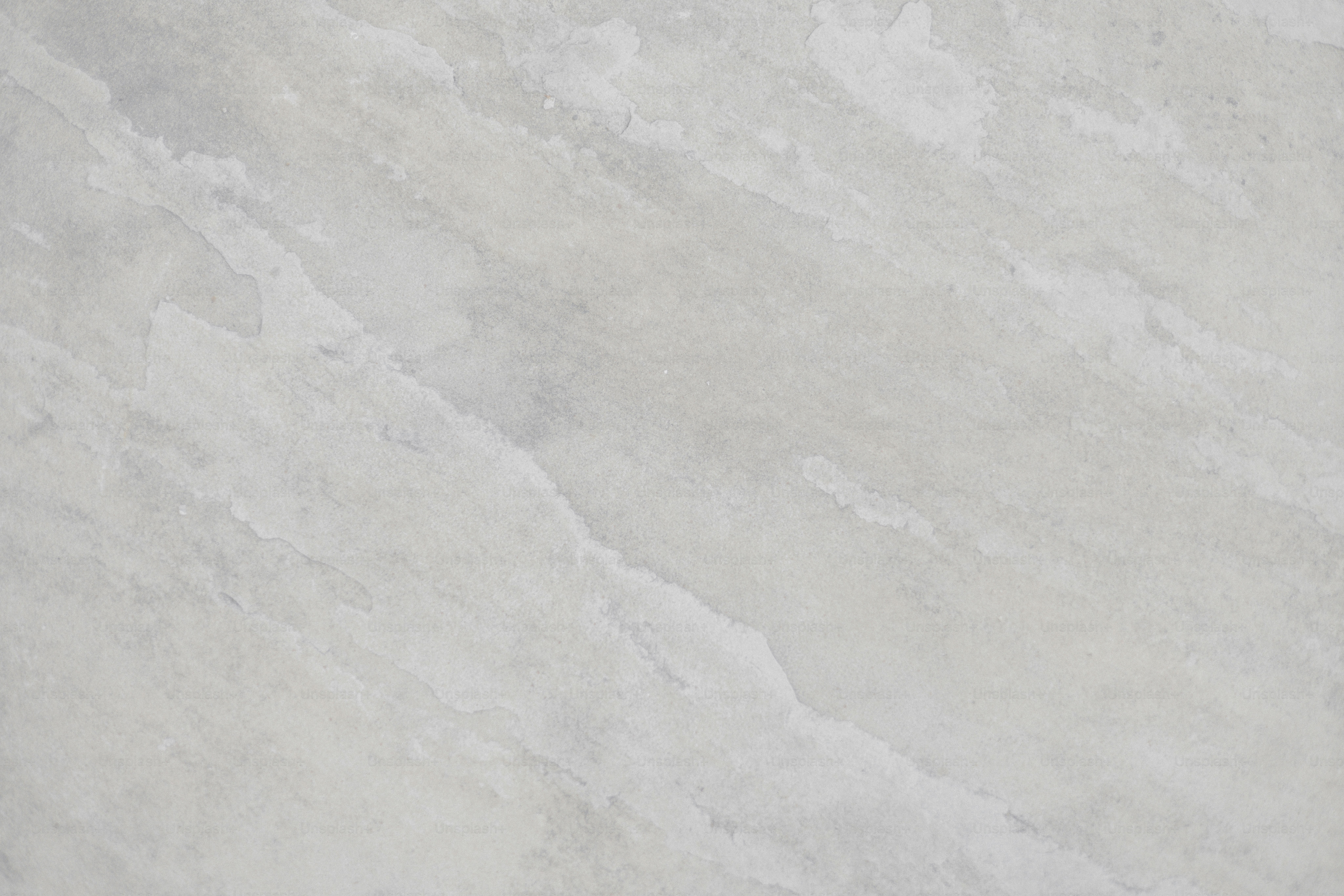 Here is a caption for the image: gray marble surface with natural veining.