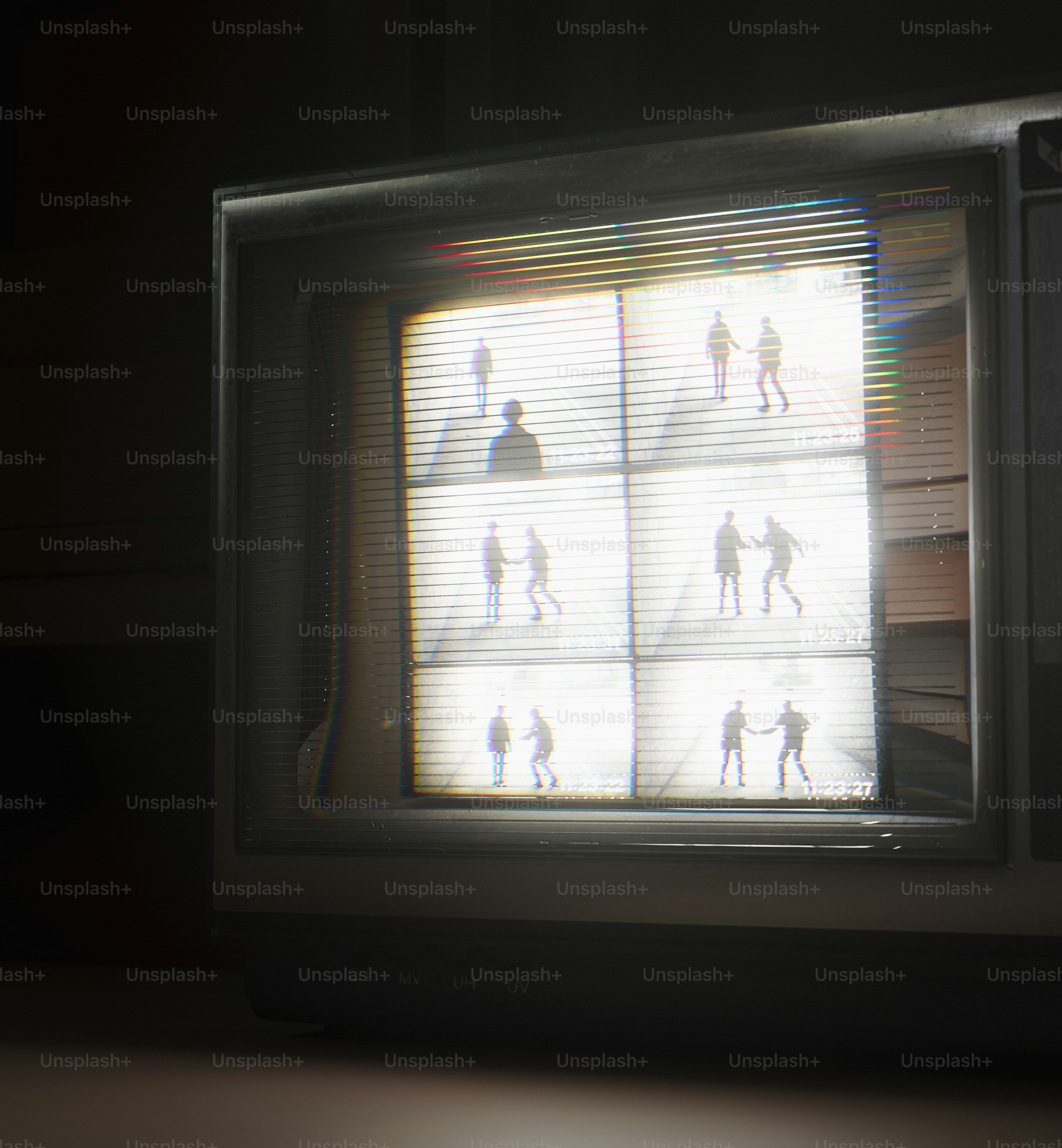 A retro TV shows a split-screen surveillance feed. photo – Technology ...