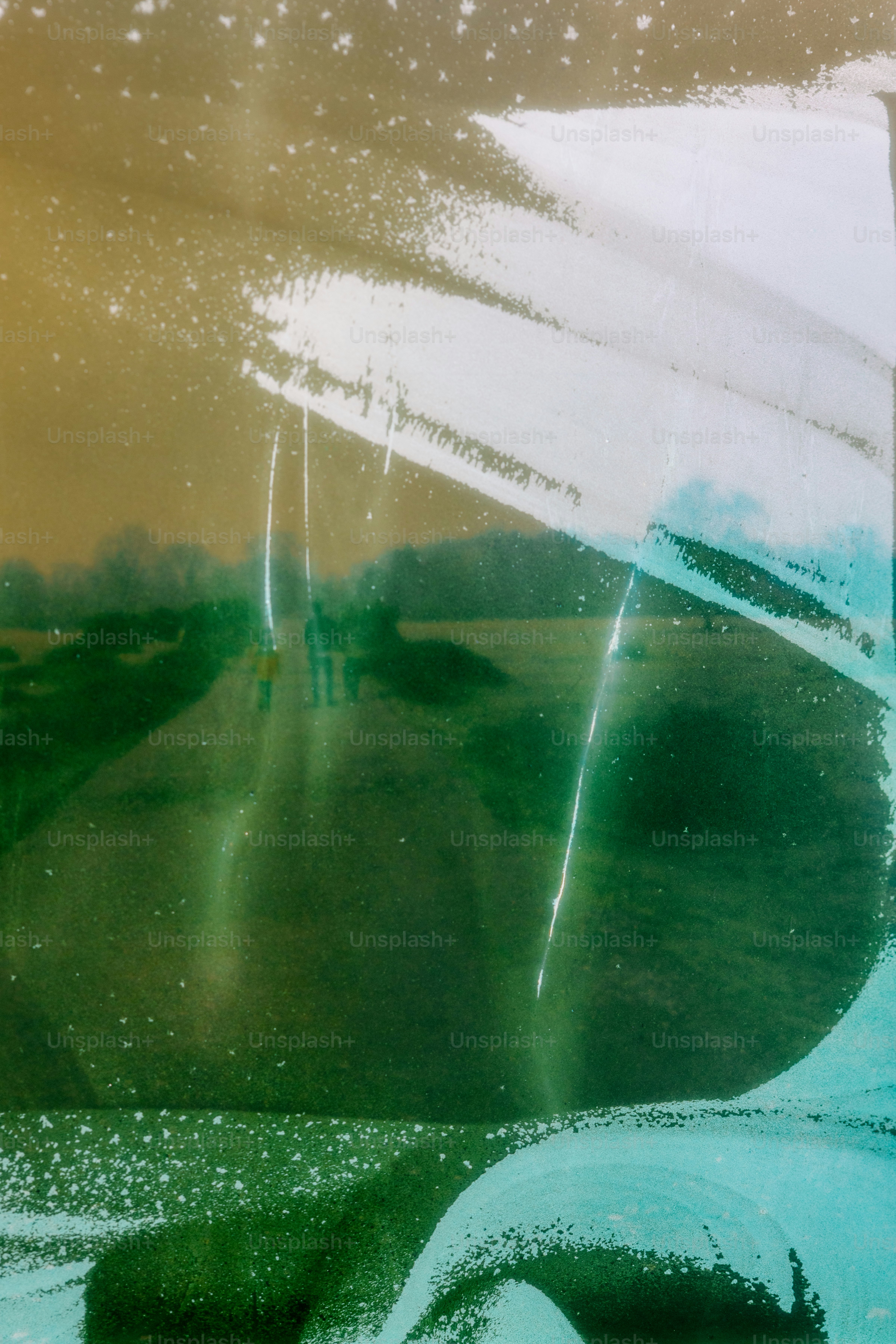 Abstract art over a landscape view.