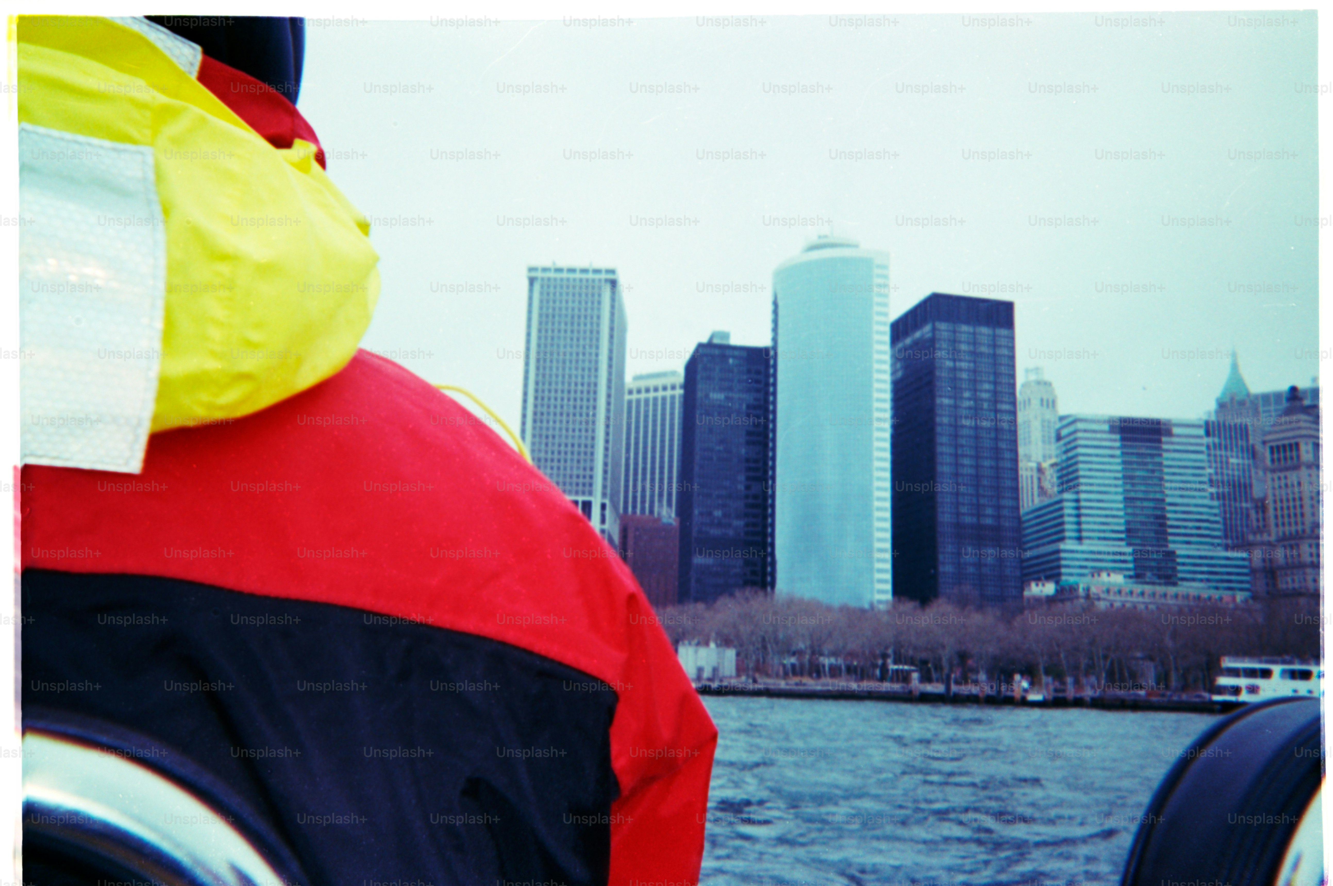 Cityscape viewed from a boat on the water.
