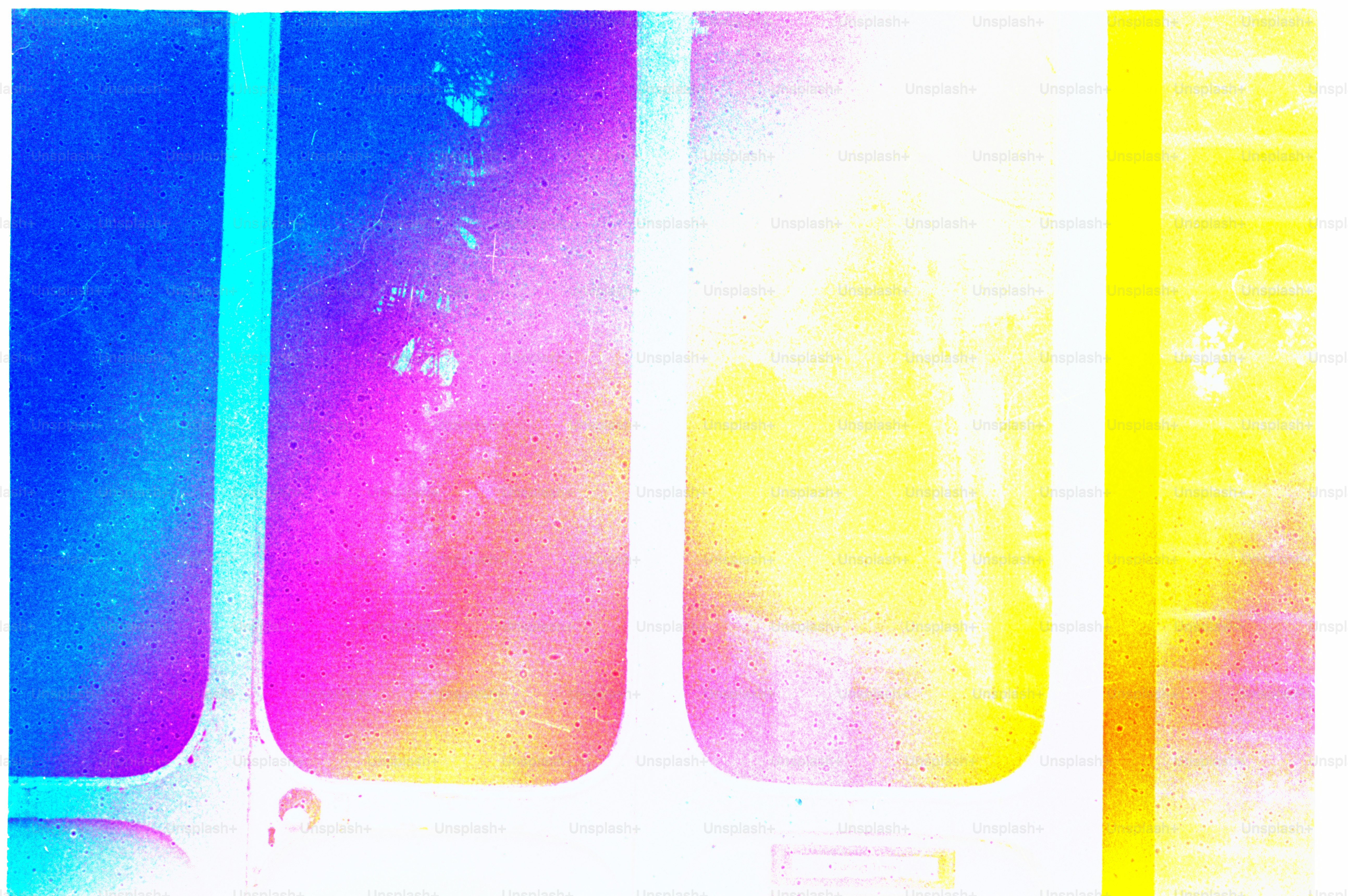 Colorful light filters through film strips.