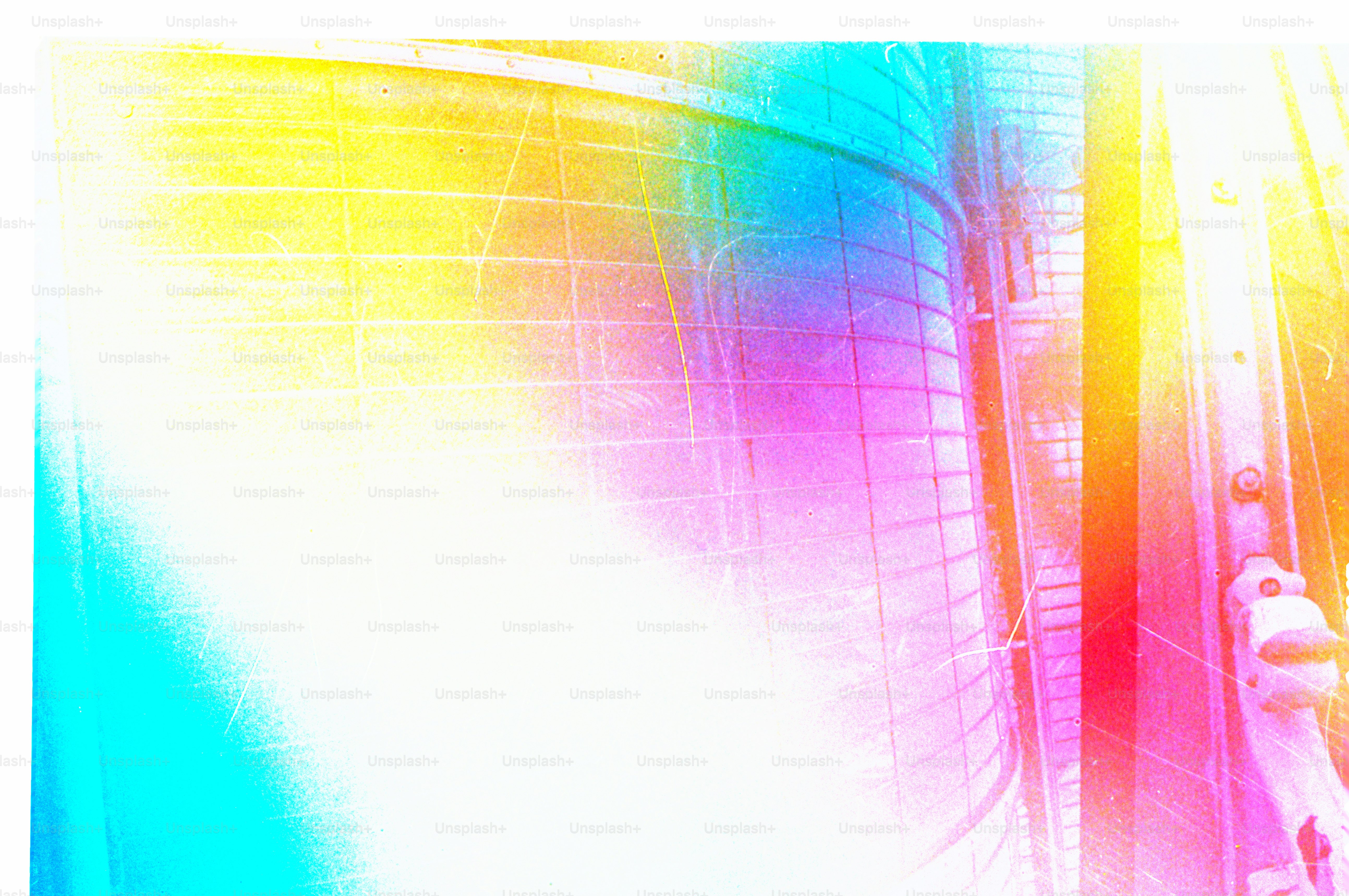 Colorful light shines on a building's exterior.