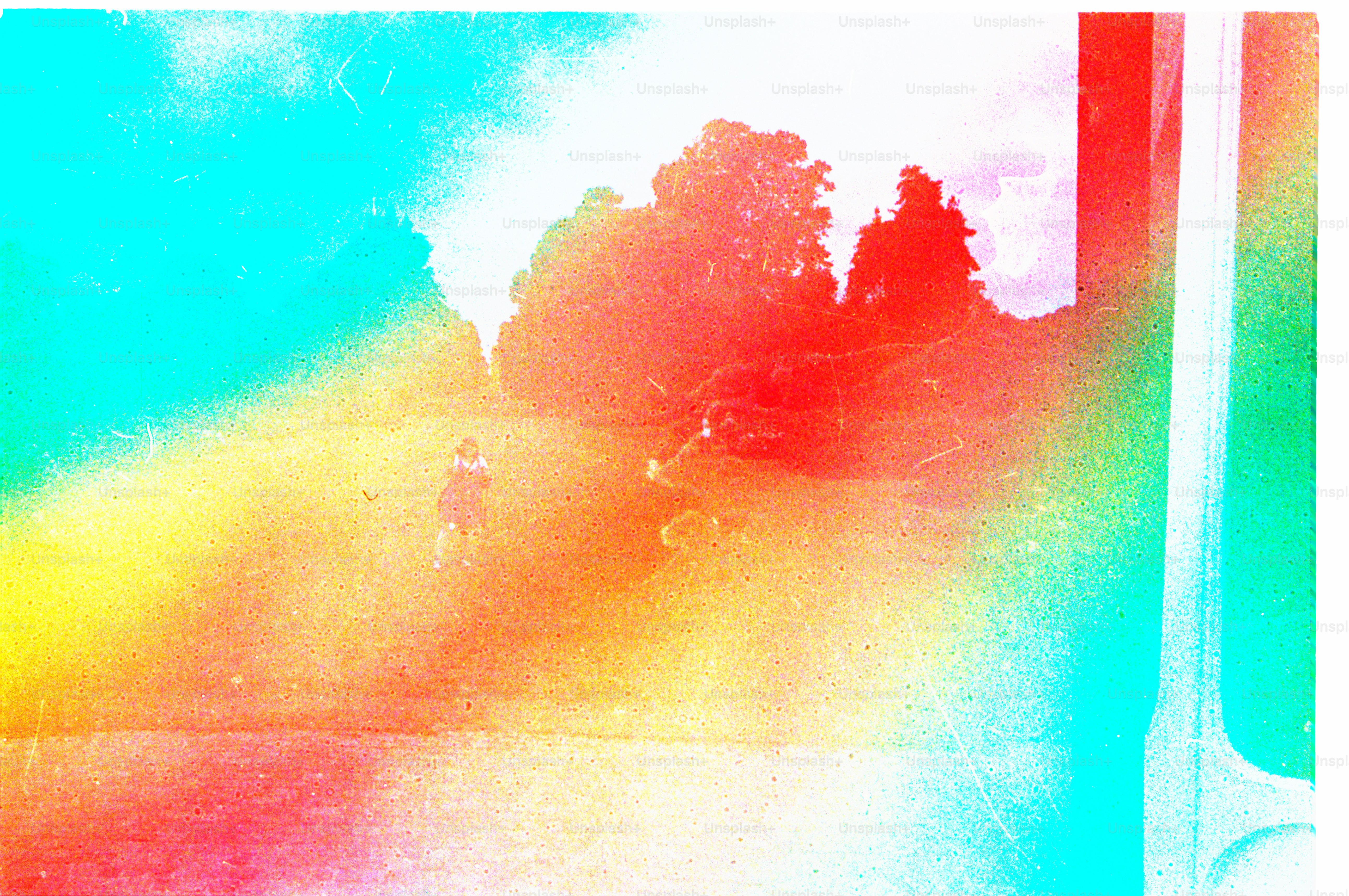 A colorful landscape with a person is shown.