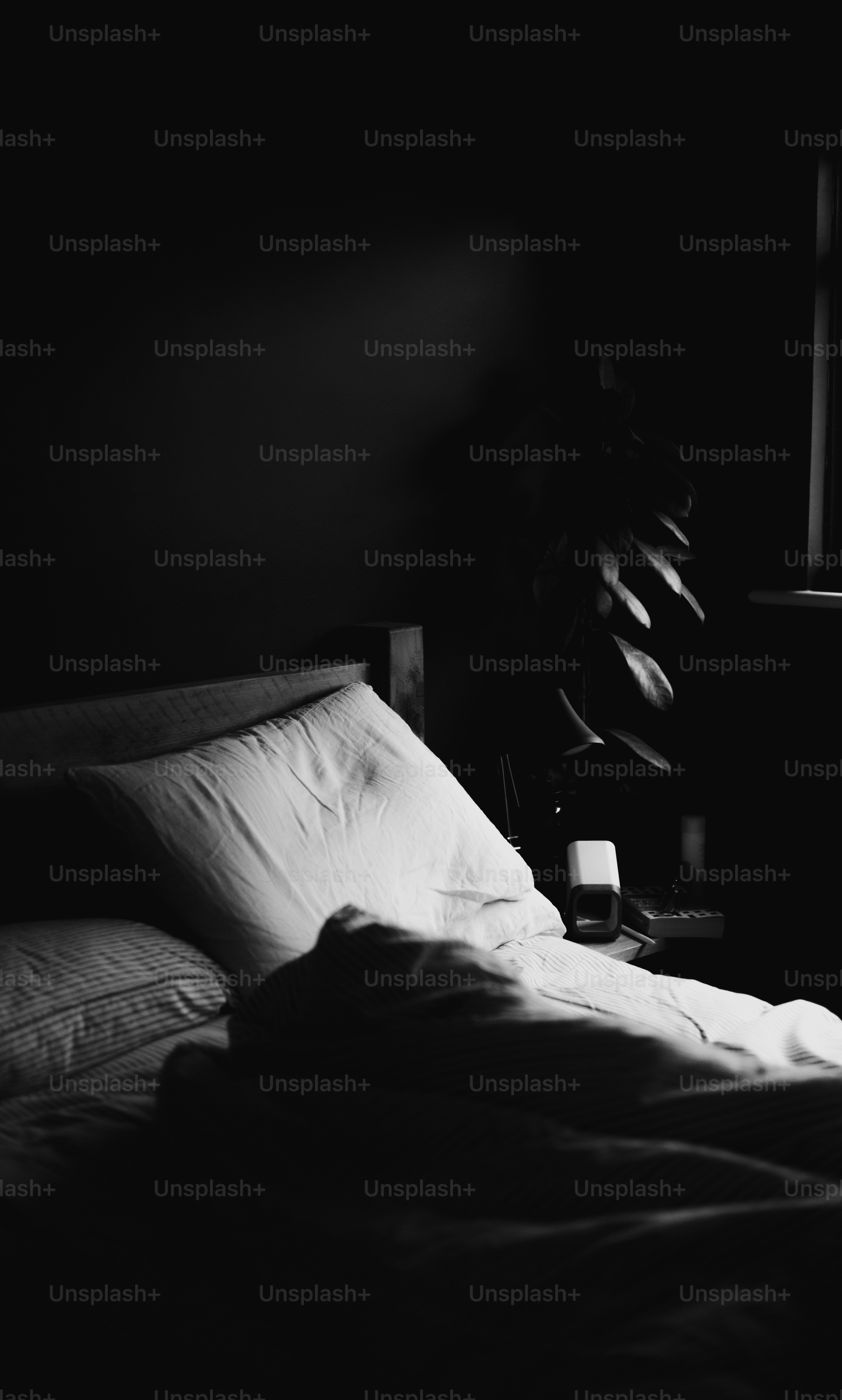 A bed with pillows and soft sheets.