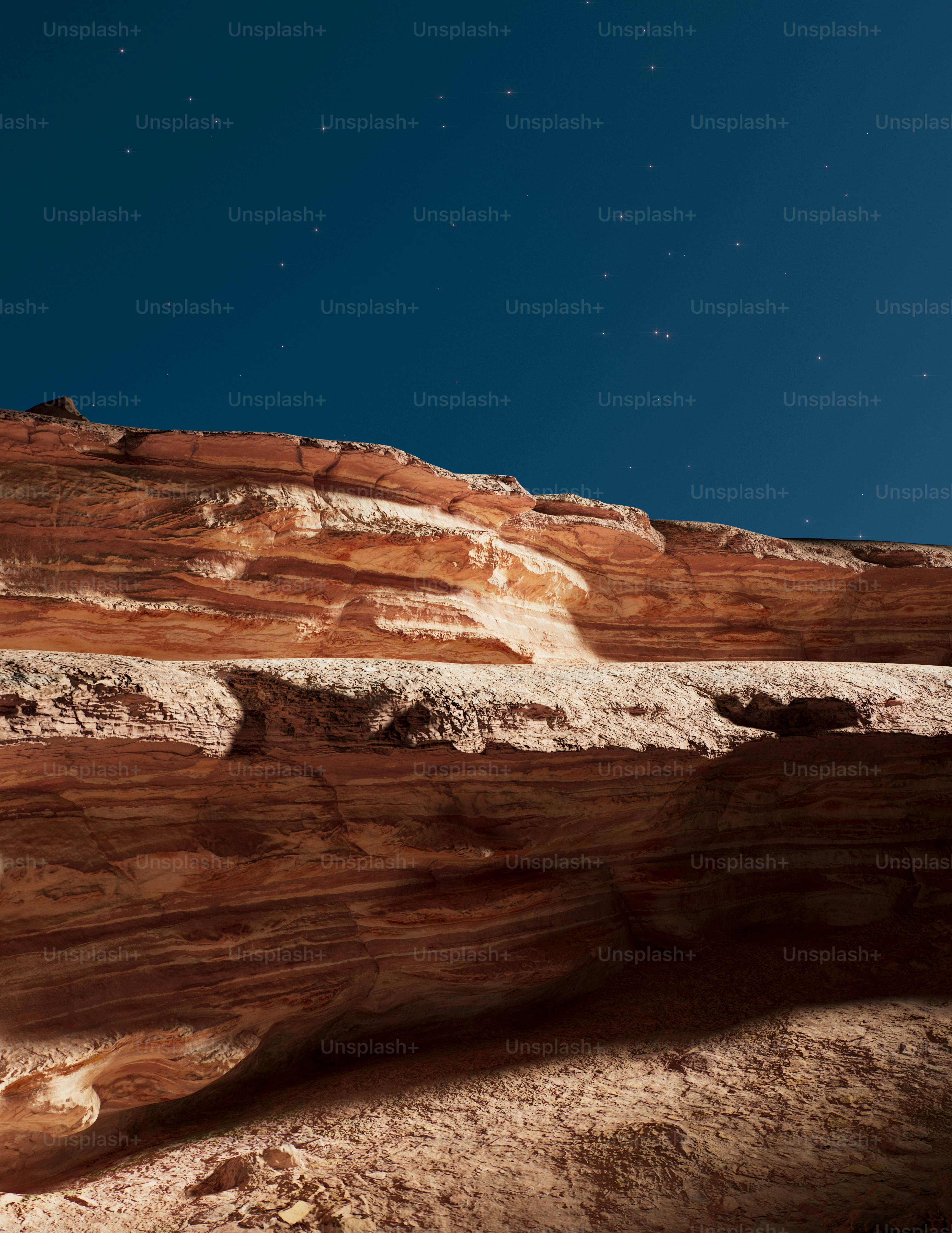 Rock formations under a starry night sky