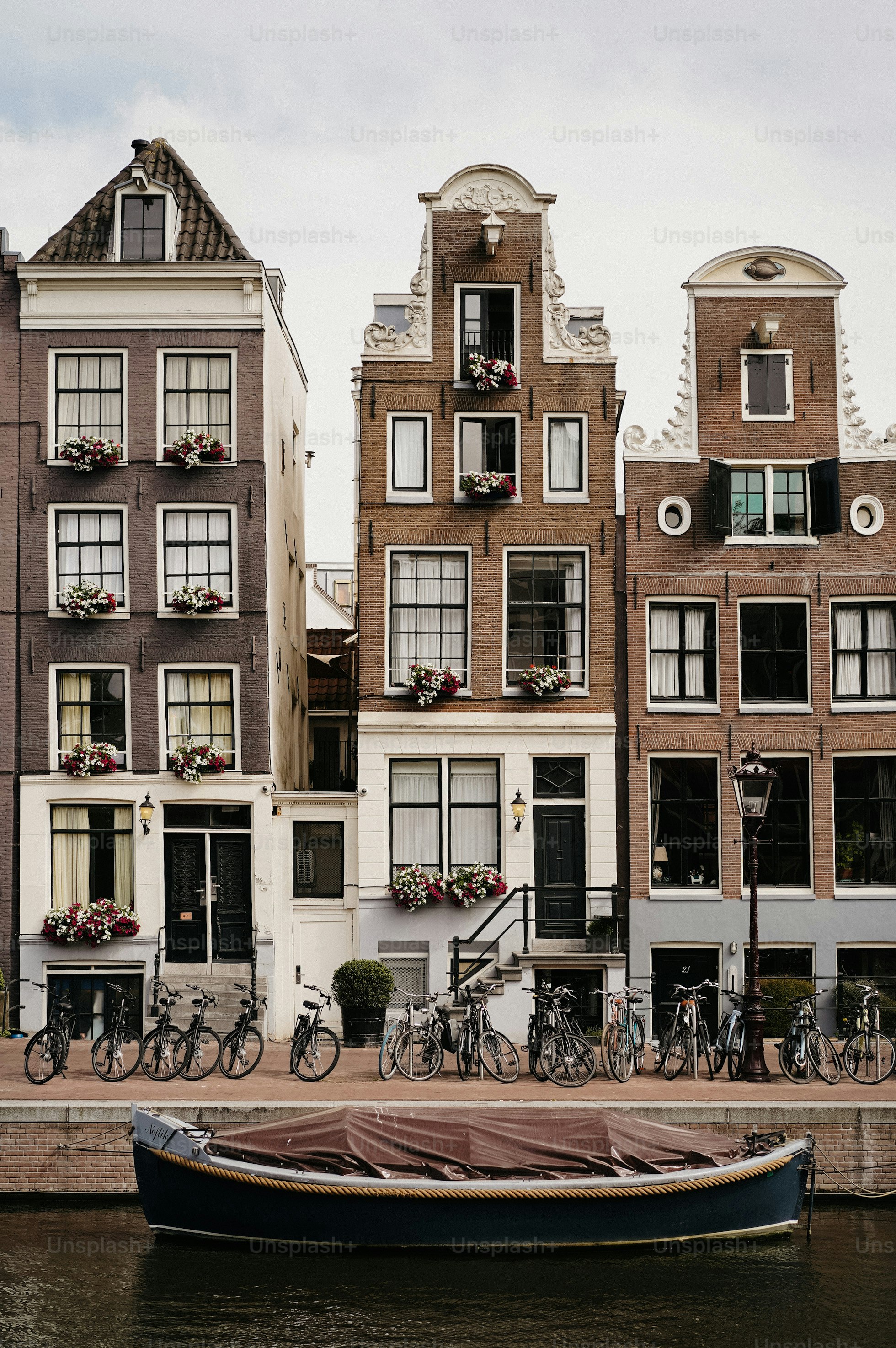 Beautiful, historic buildings line a canal in amsterdam