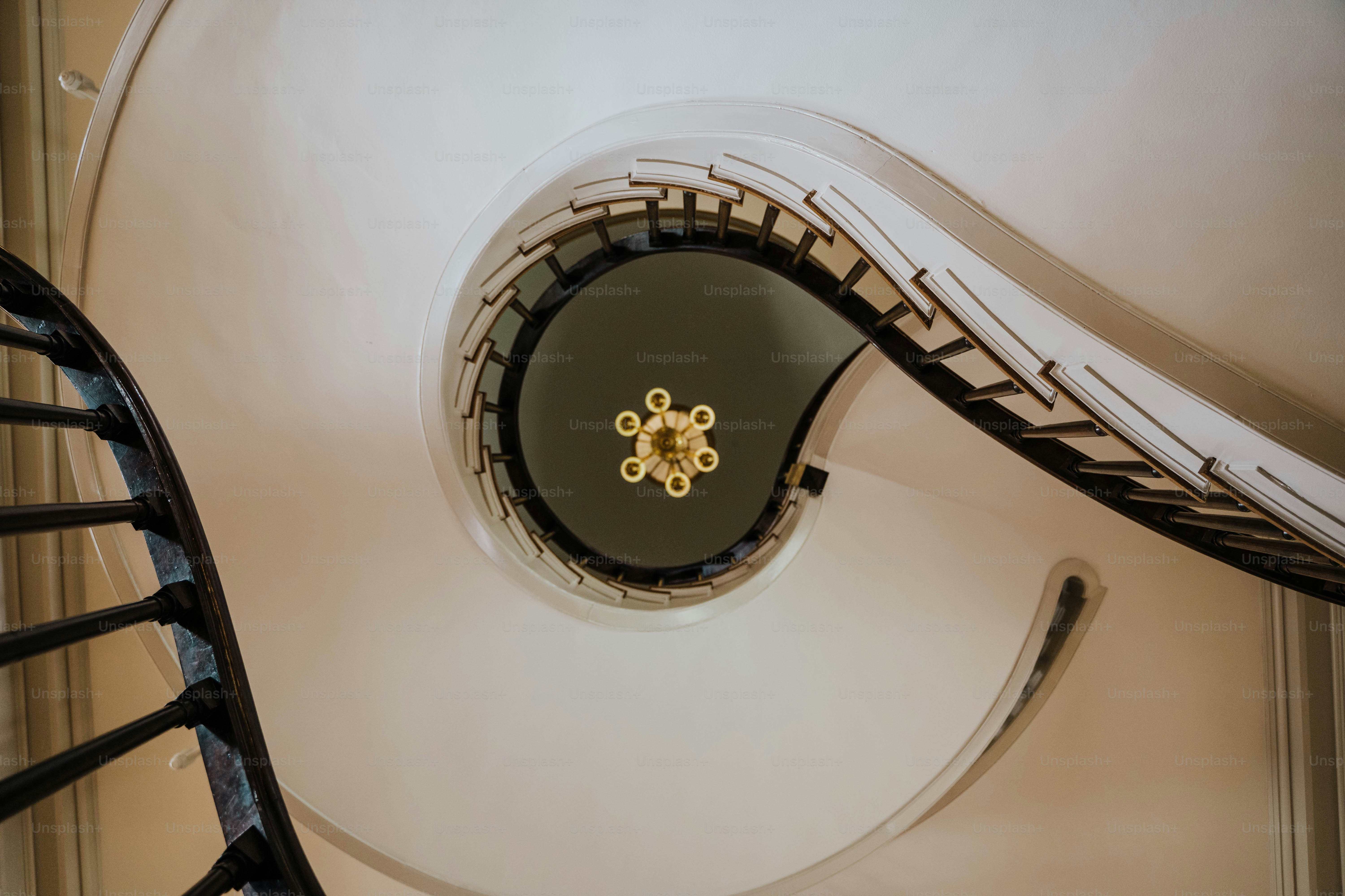 A spiral staircase viewed from below.