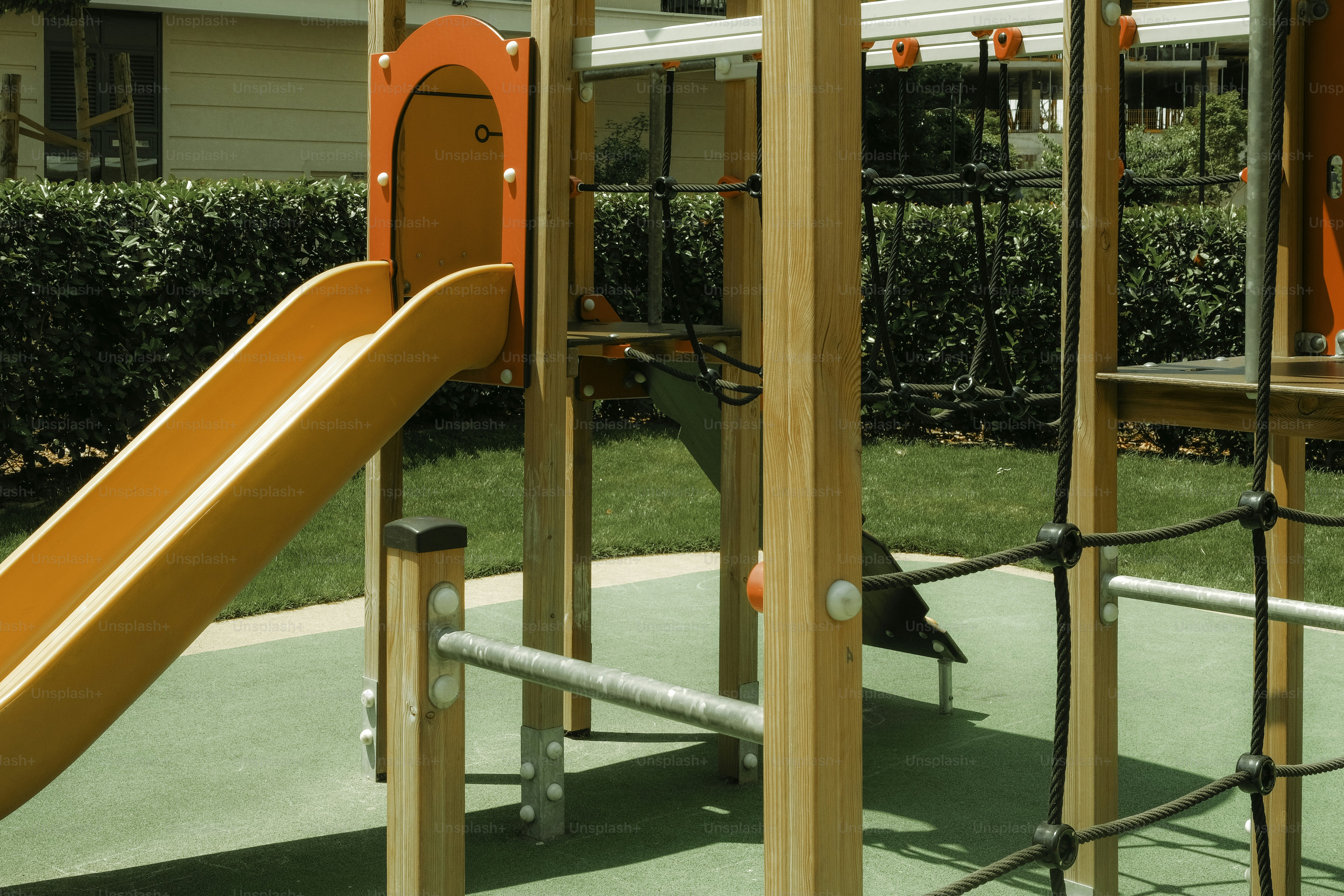 A playground with slides, bars, and nets.