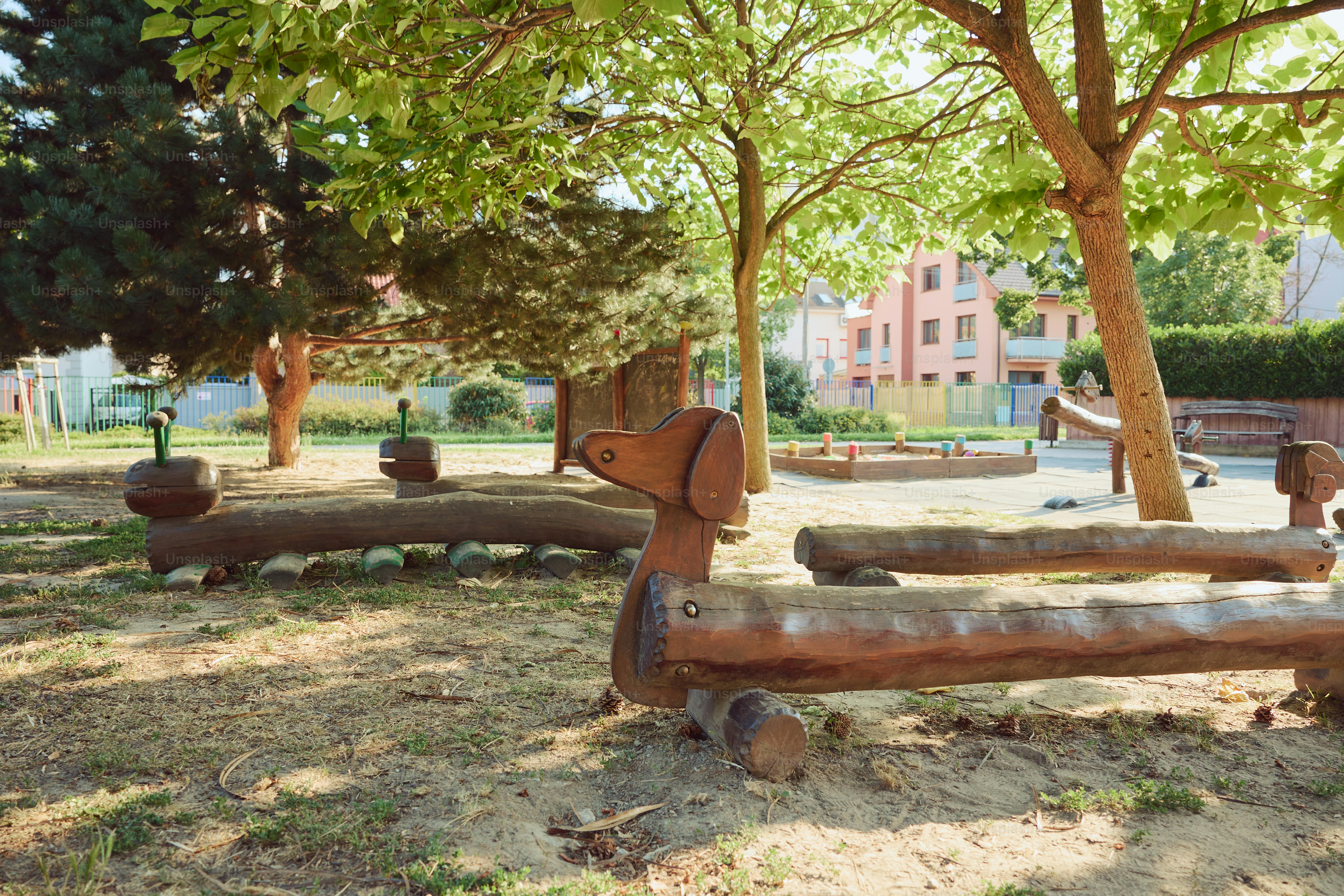 A playground with wooden benches and structures is visible.