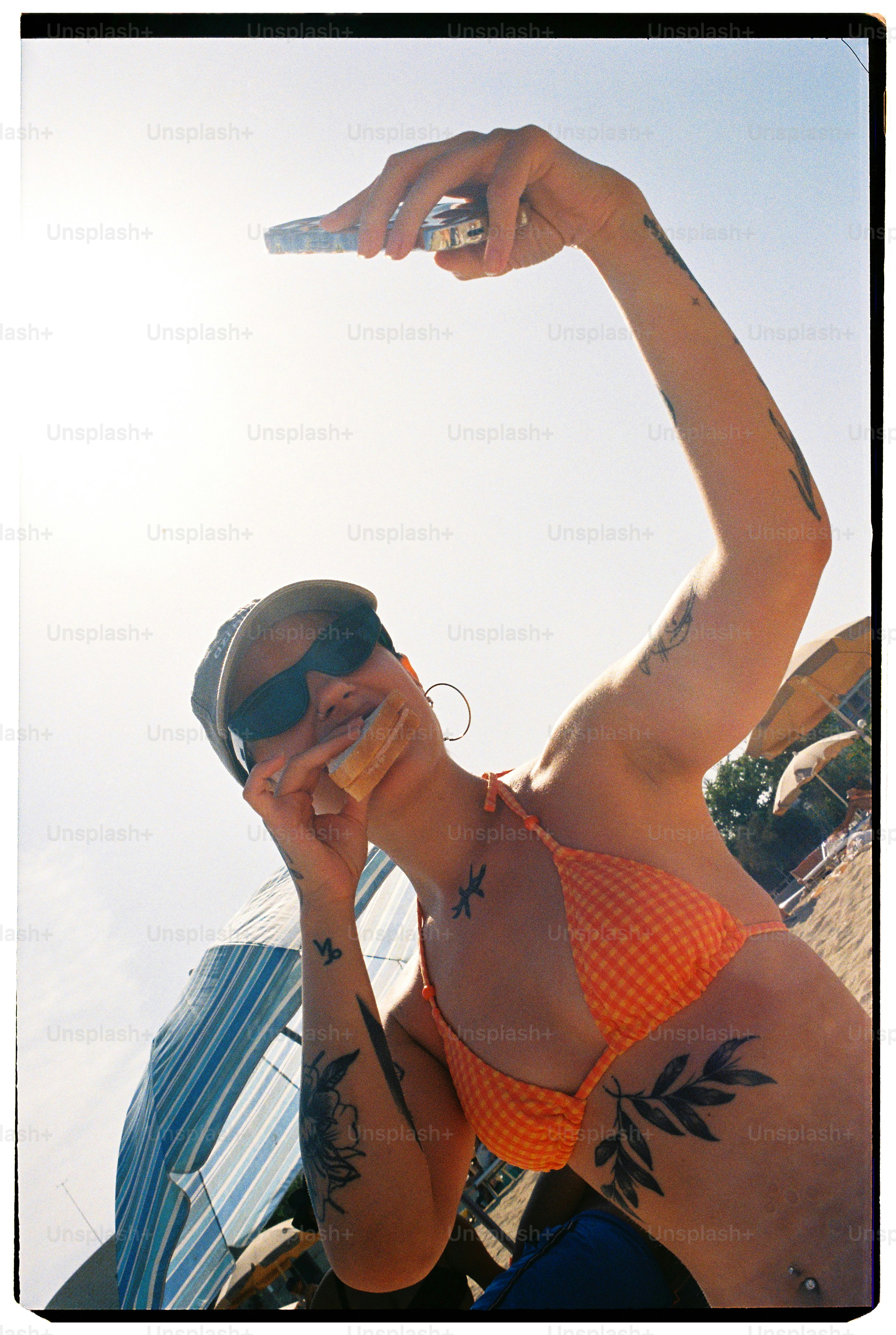 Woman takes a selfie while enjoying a snack.