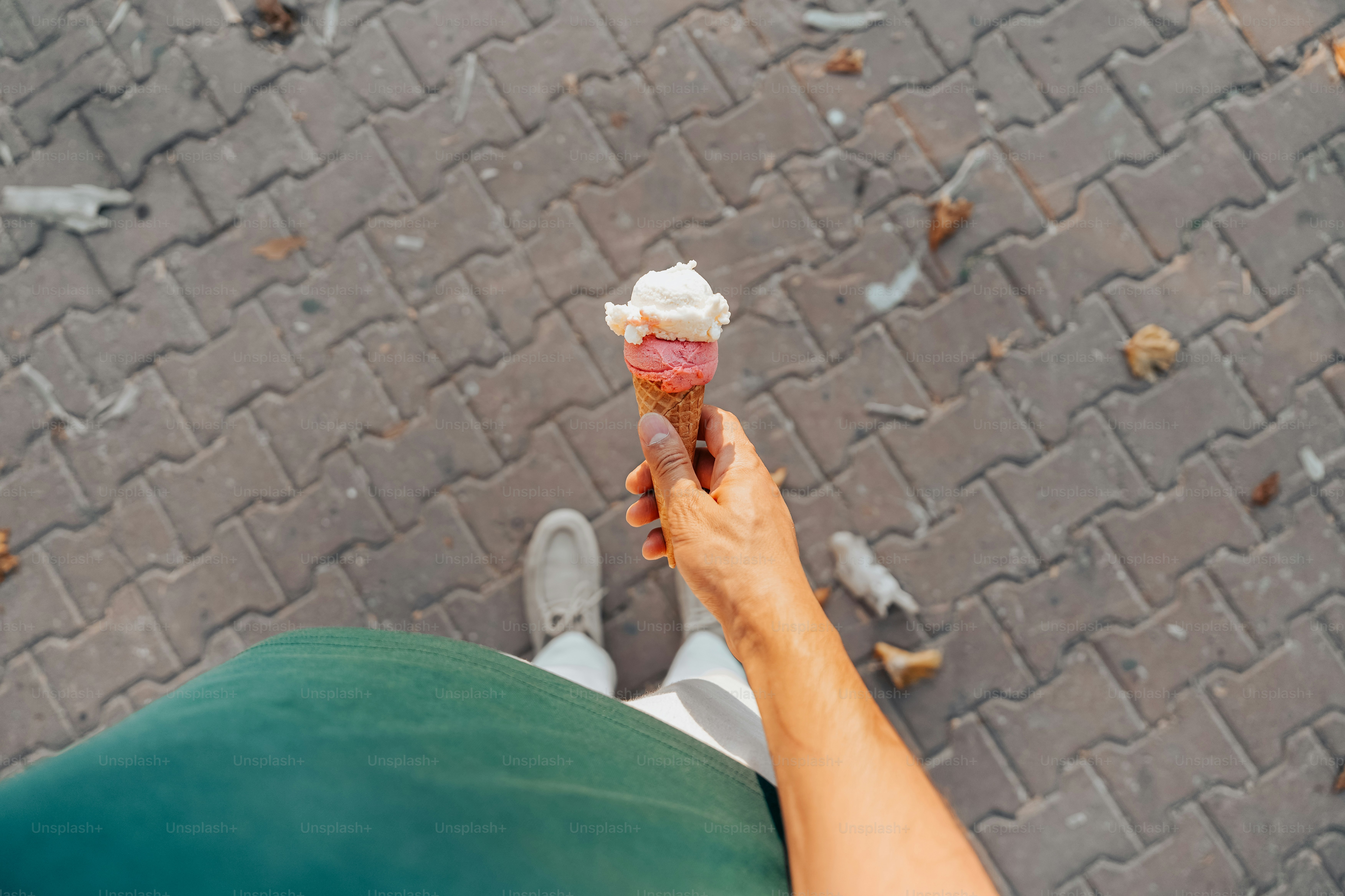 Holding an ice cream cone.