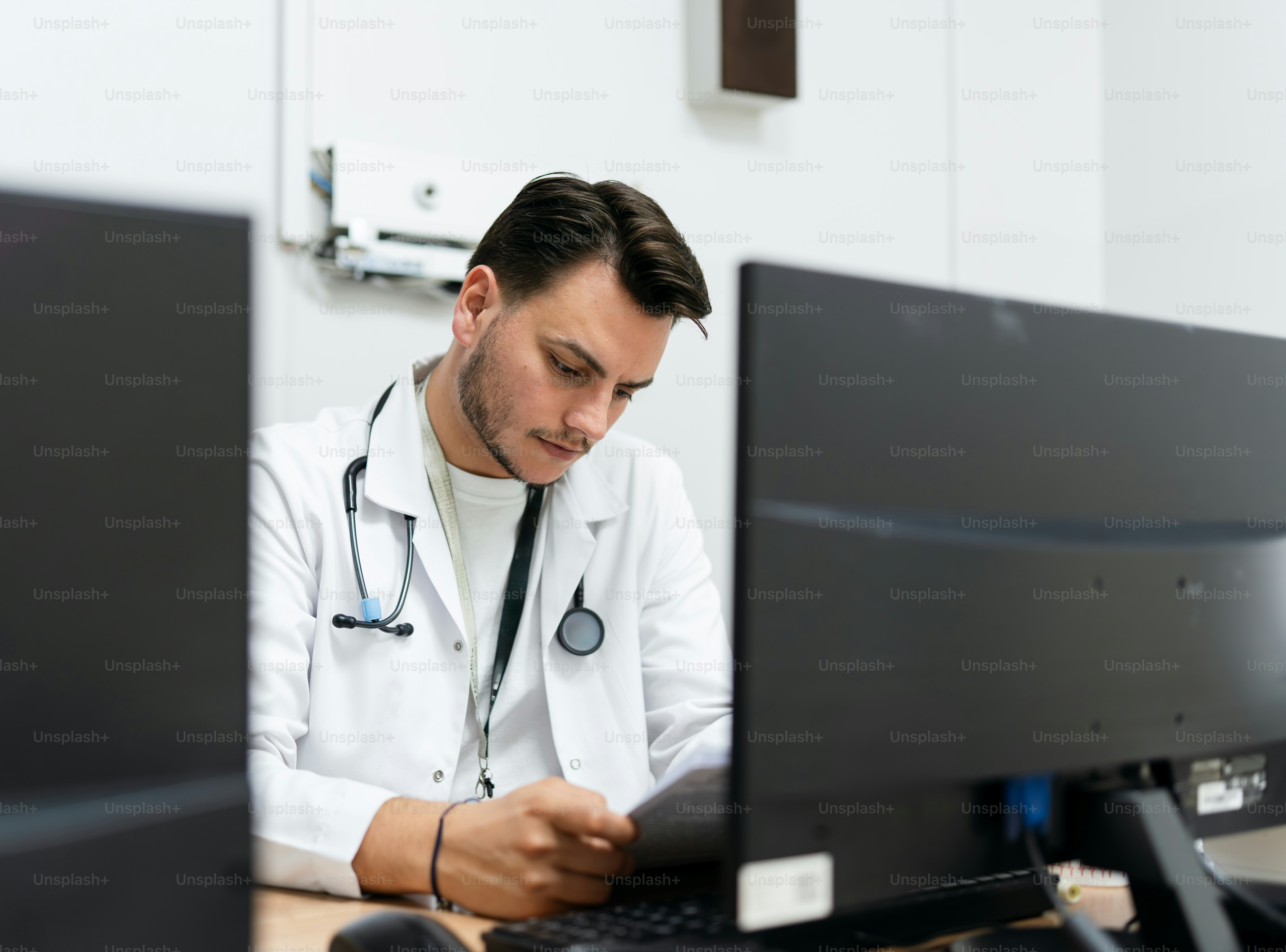 Doctor reviews a patient's chart at his computer