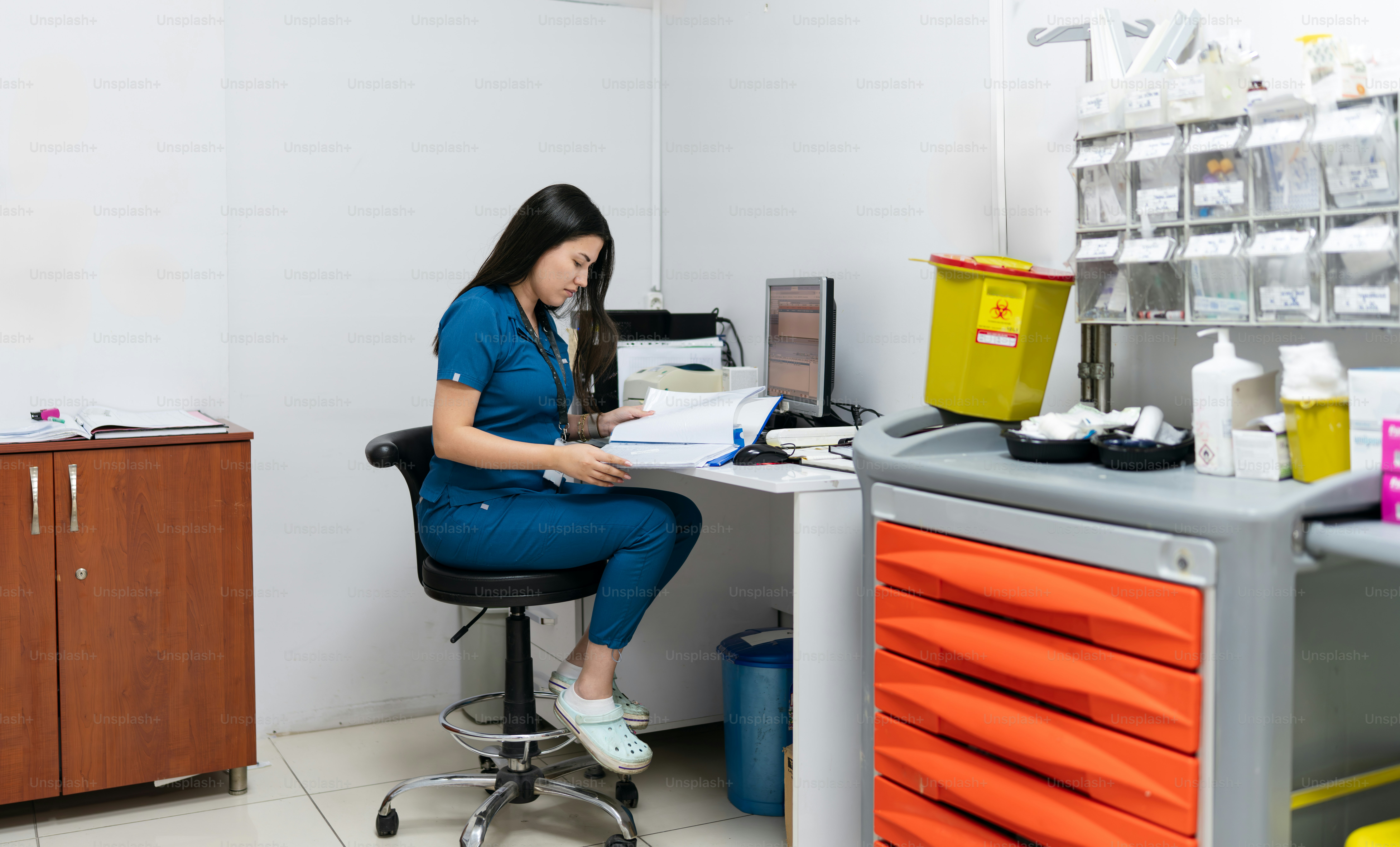 A medical professional conducting a health screening for an employee in a modern office setting